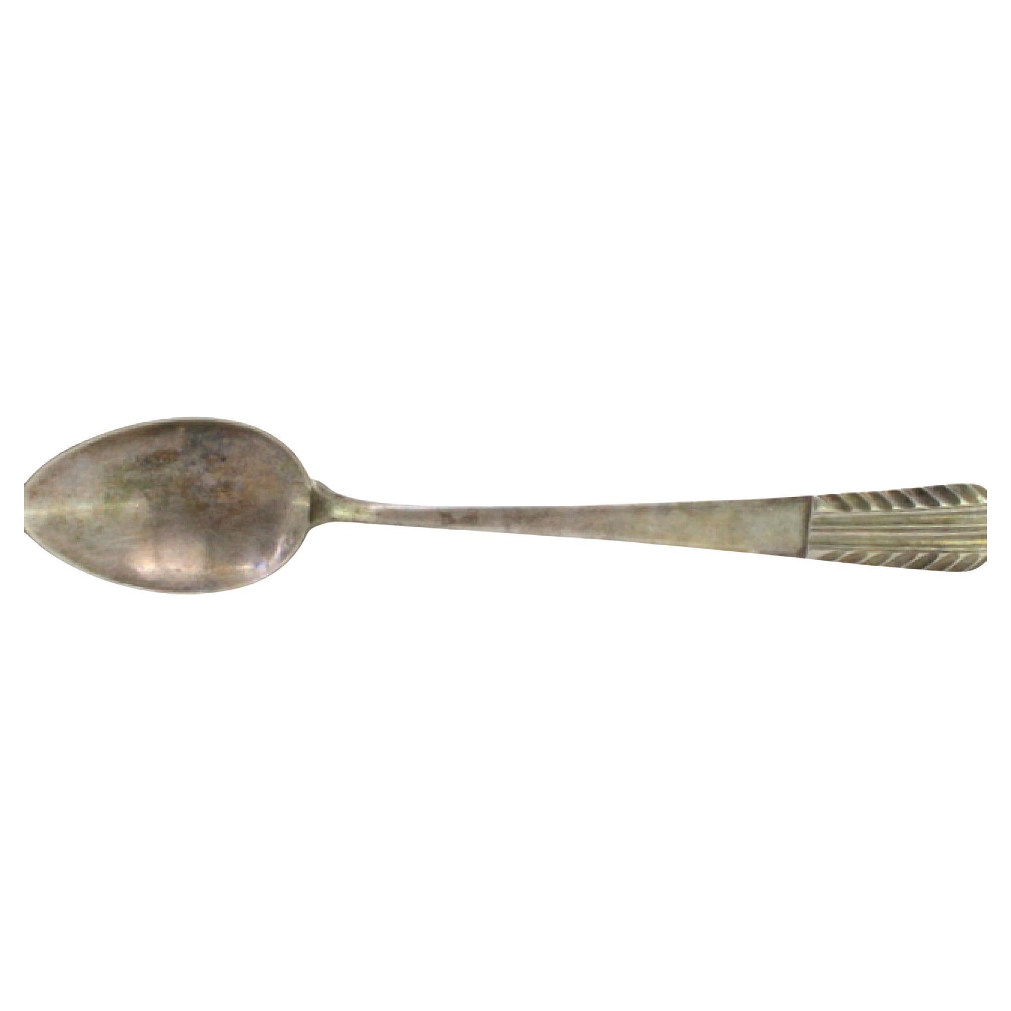 Rice spoon and serving with reliefs and grooves on the handle