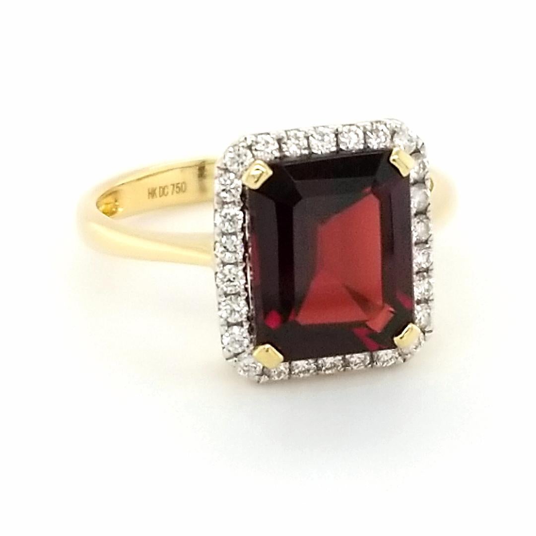 A classic look with a classic stone, The Carmine suite is sure to please even the most particular design purist. Rich 18k yellow gold glistens next to the halo of diamonds surrounding the true red pomegranate color of a rich almandine garnet.