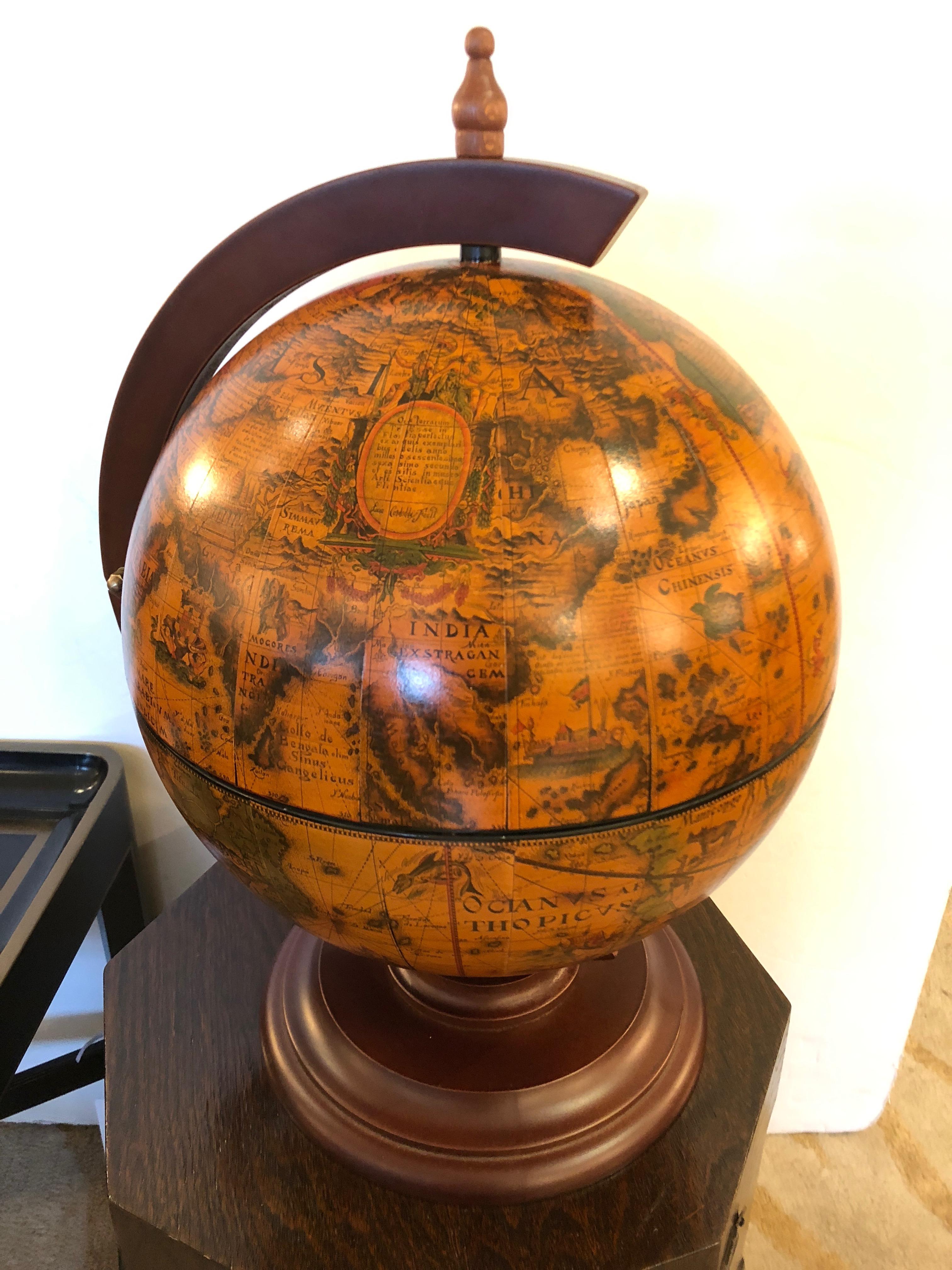 A gorgeous globe in warm browns, gold, green, orange and black, that opens to reveal a roulette game inside.