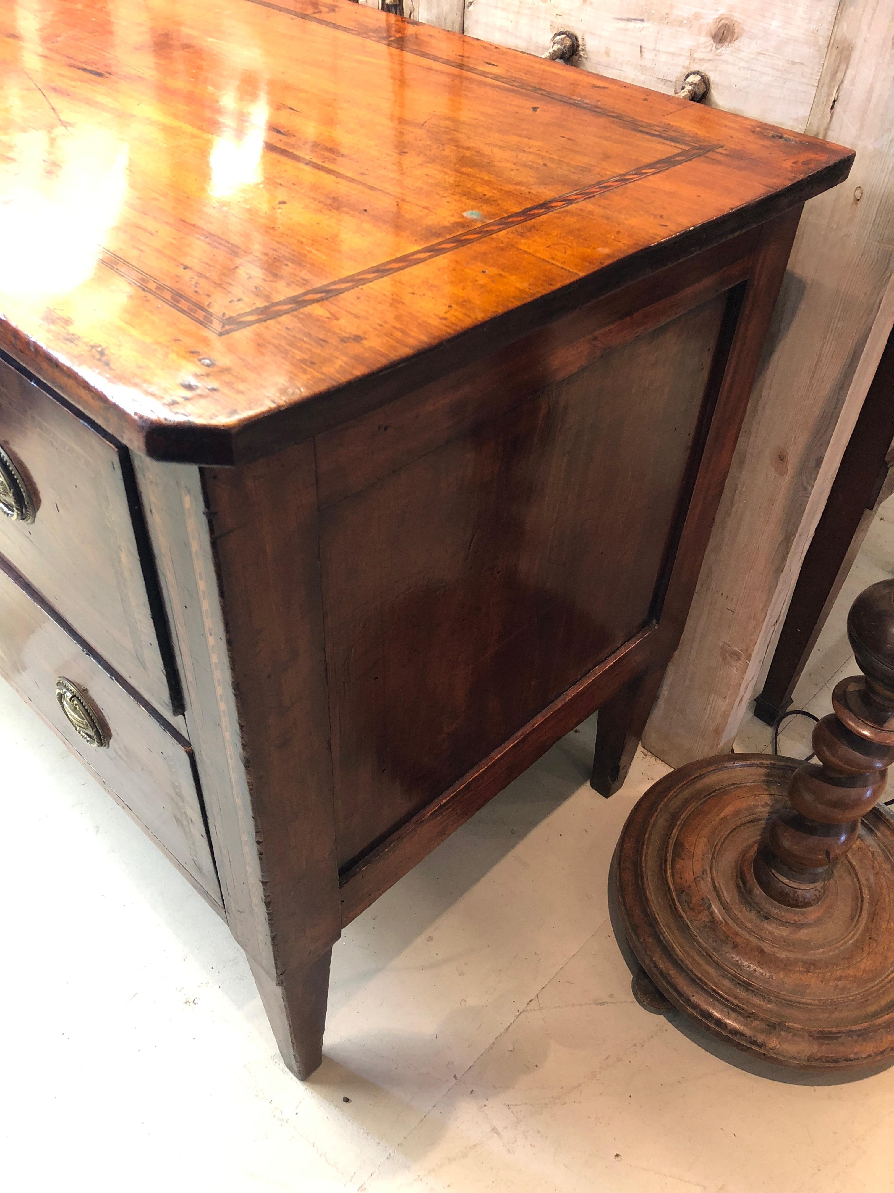 Great looking antique mahogany inlay commode having two roomy drawers with original hardware. Very handsome inlay around periphery of top.