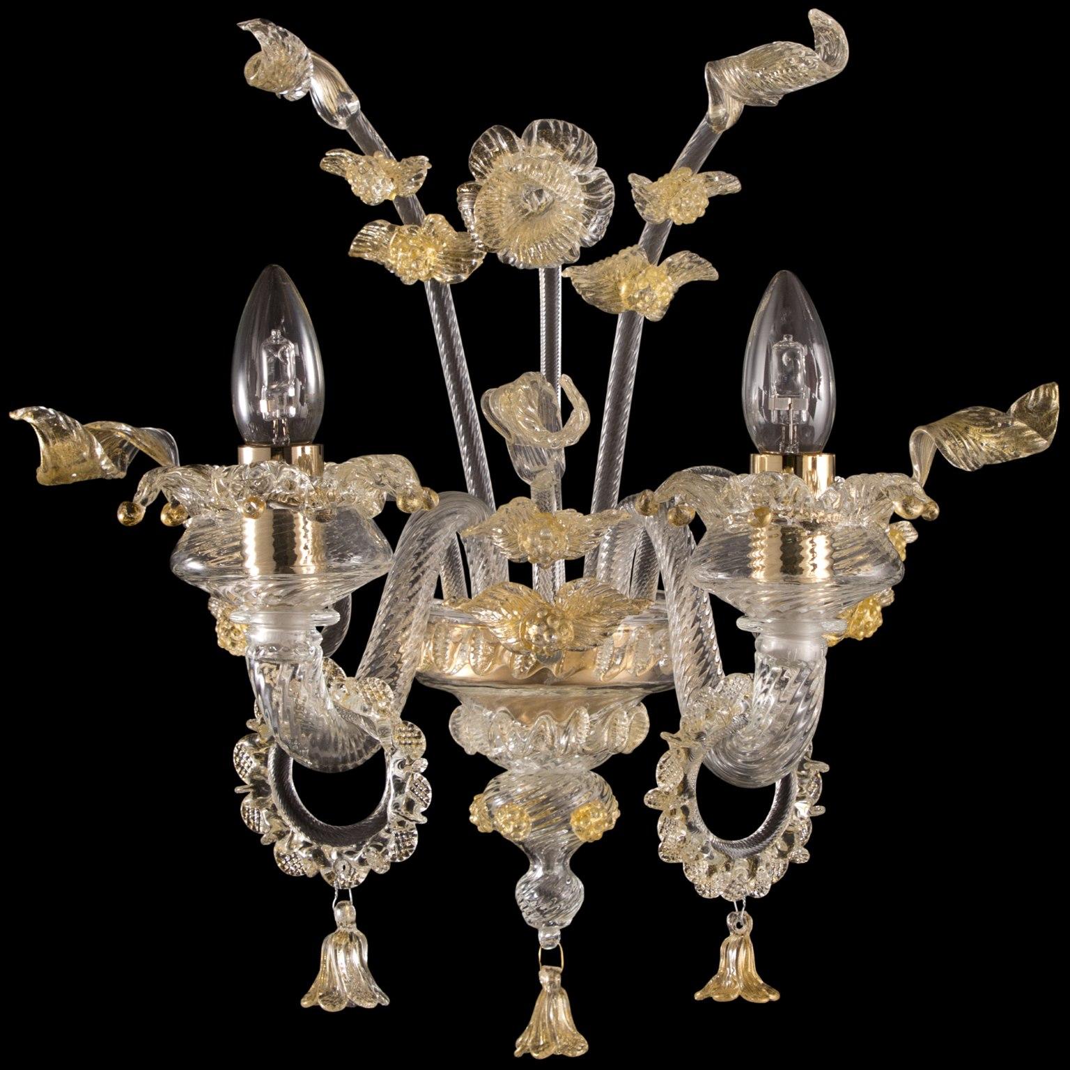 Rich Murano sconce 2 Arms crystal and gold Murano Glass Fenix by Multiforme.
The blown glass chandelier Fenix, with its floral style, harks back to the venetian classic tradition. The decorative elements are characterized by flowers modelled petal