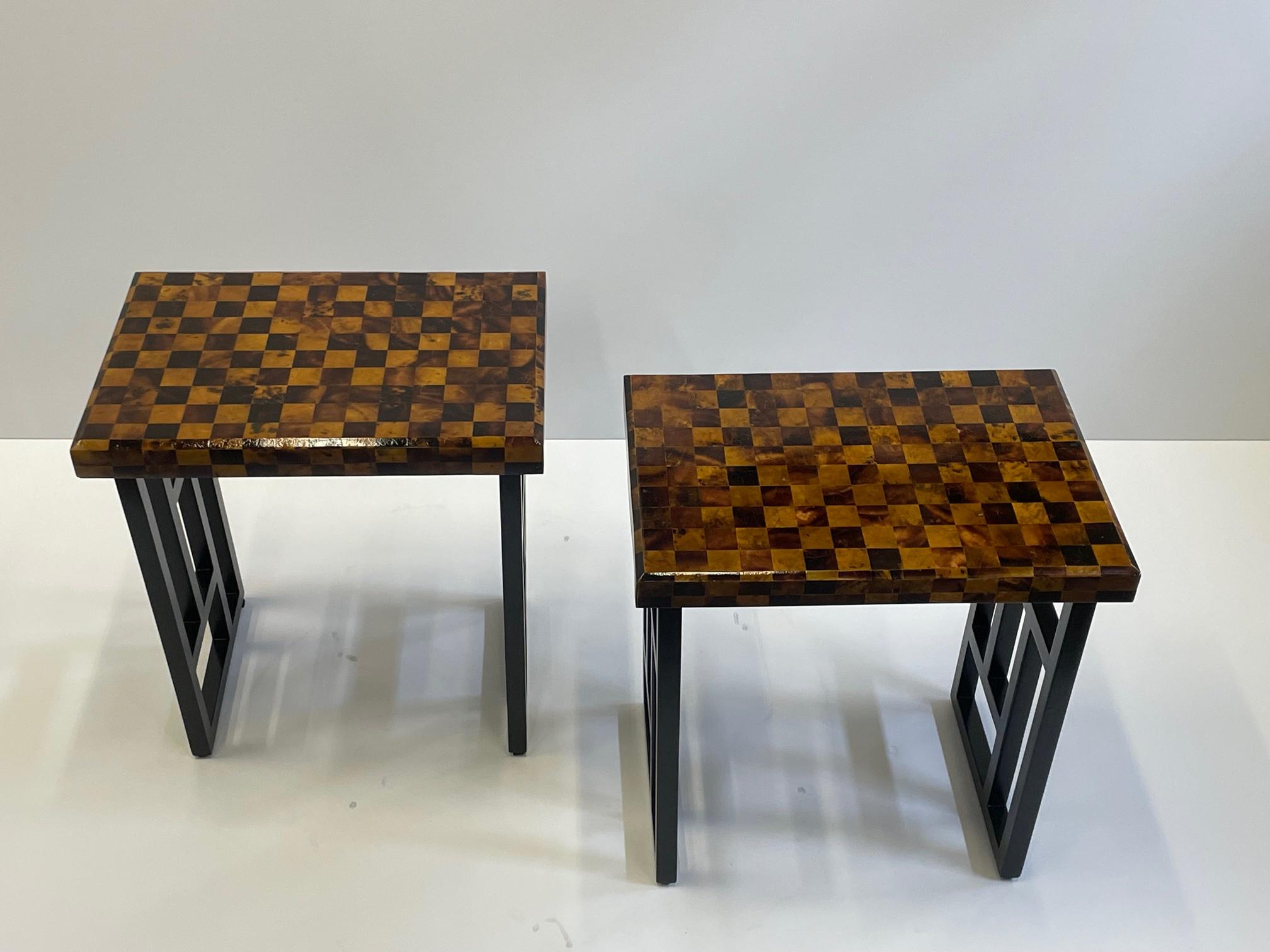 Marvelous pair of vintage rectangular small martini end tables having strikingly detailed checkerboard pattern on top in ebonized wood and crushed coconut shell.