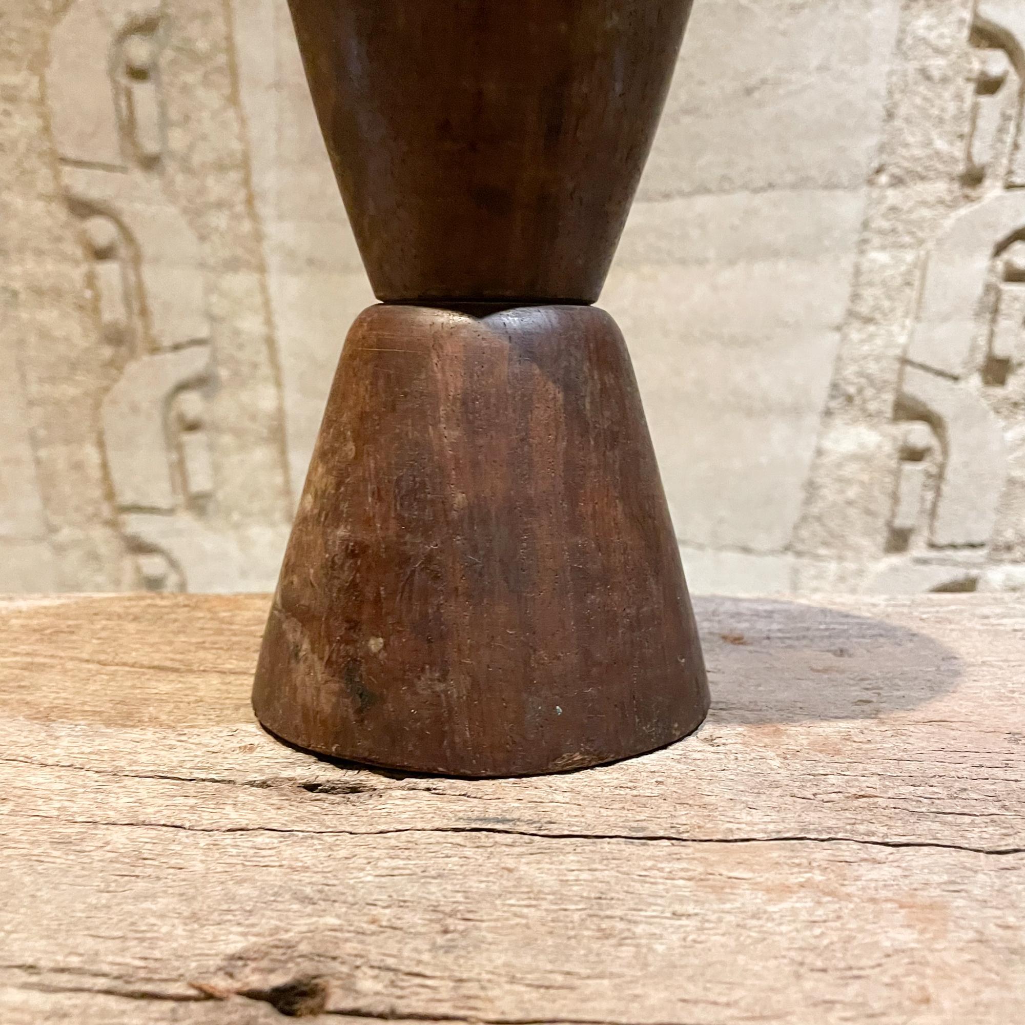 Heavy solid wood chalice cone shape vase in the manner of Don Shoemaker Made in Mexico 1970s
Crafted in Palo Fierro very heavy wood in a dark grain. Unmarked.
Measures: 11.5 height x 5 in diameter inches
Unrestored vintage condition. Refer to