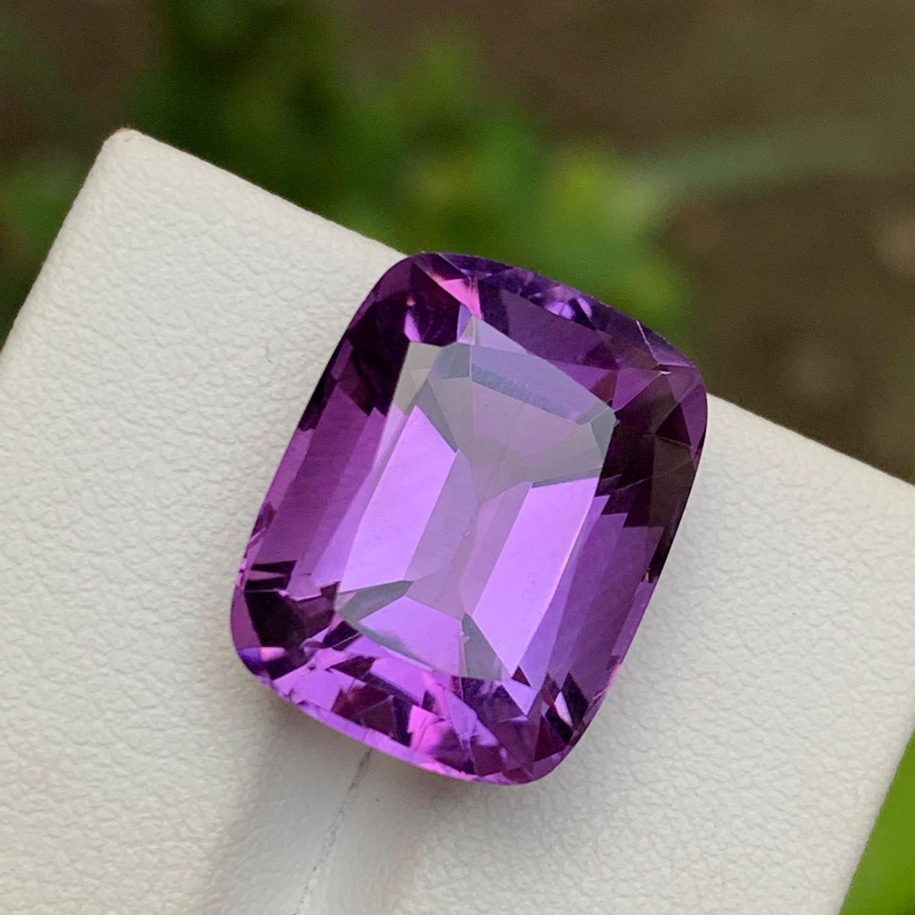 GEMSTONE TYPE: Natural Amethyst 
PIECE(S): 1
WEIGHT: 15.55 Carats
SHAPE & Cut: Cushion Cut
SIZE (MM):  17.37 x 13.54 x 10.38
COLOR: Purple
CLARITY: Eye Clean
TREATMENT: None
ORIGIN: Brazil
CERTIFICATE: On demand
(if you require a certificate, kindly