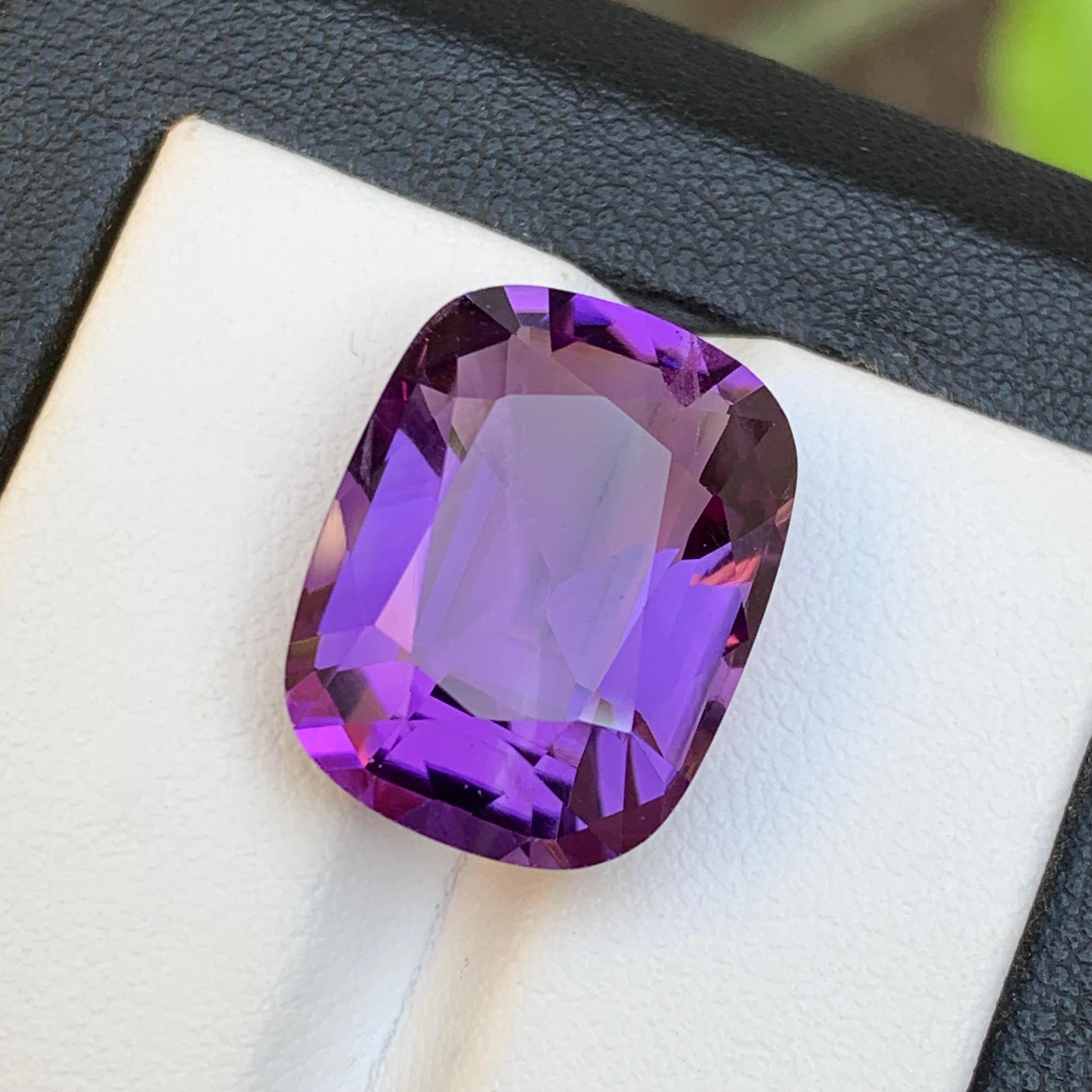 GEMSTONE TYPE: Natural Amethyst 
PIECE(S): 1
WEIGHT: 14.00 Carats
SHAPE & Cut: Cushion Cut
SIZE (MM):  17.83 x 13.80 x 9.21
COLOR: Purple
CLARITY: Eye Clean
TREATMENT: None
ORIGIN: Brazil
CERTIFICATE: On demand
(if you require a certificate, kindly