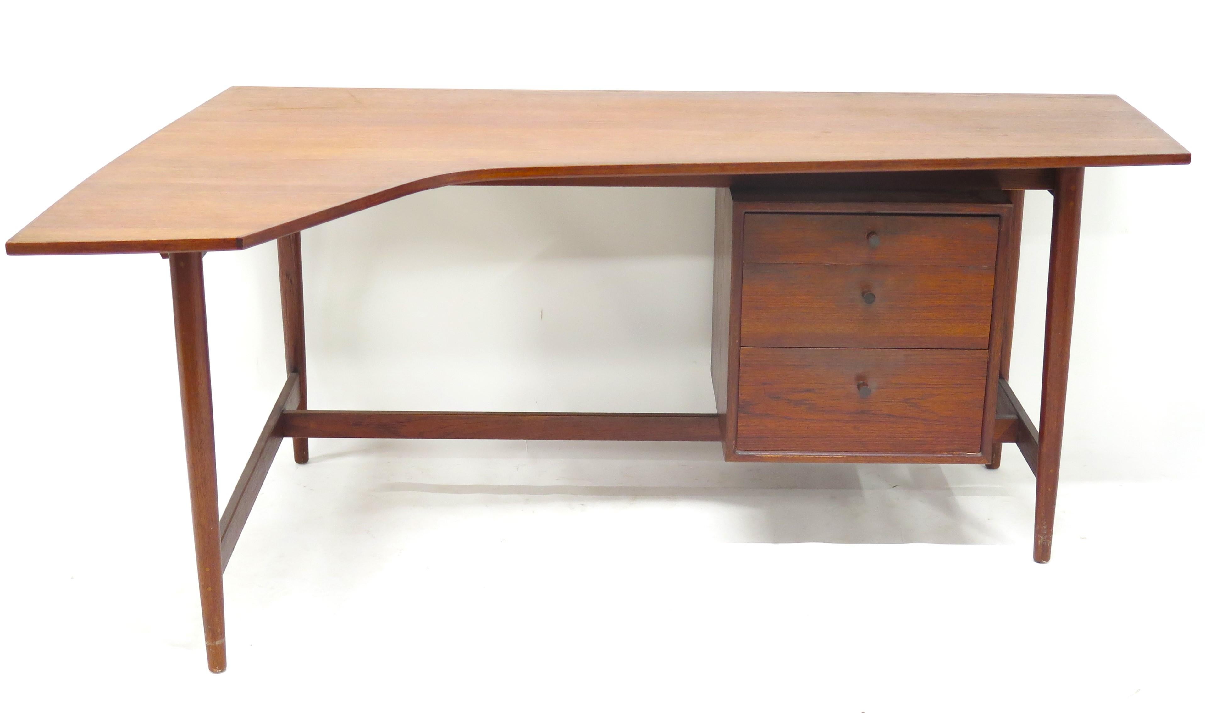 Mid-Century Modern Richard Artschwager Studio walnut desk, featuring a right corner boomerang style design, floating three drawer cabinet, four legs, original pulls, with a beautiful walnut finish. This is an exceptional combination of quality and