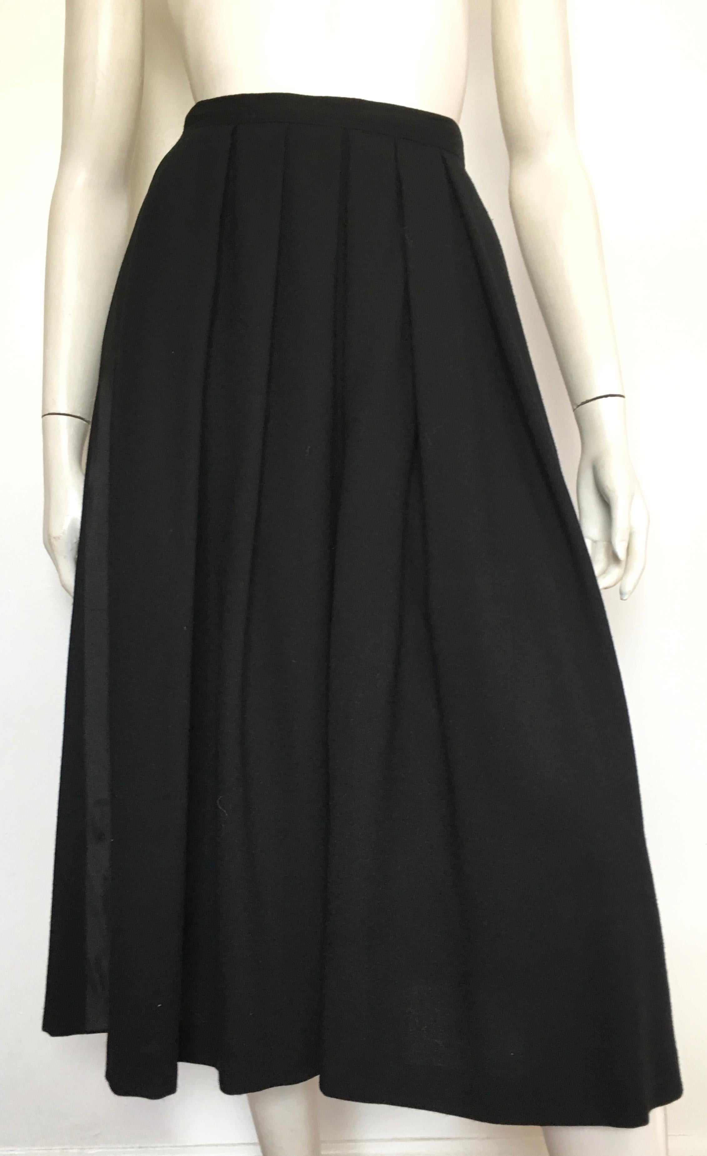 Richard Assatly's Additions 1970s black wool culottes with pockets is labeled a size 10 but fits like a size 6.  The waist is 30