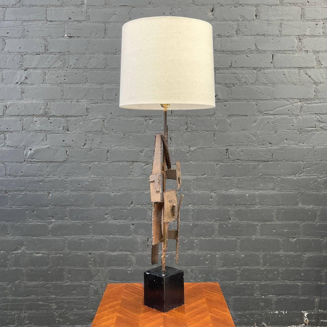 Richard Barr Brutalist Iron Table Lamp for Laurel

Newly Rewired, New Custom Linen Shade
Materials: Iron, New Linen Shade 
Dimensions: 
47”H x 5”W x 5”D
Shade:
13”H x 15”-16”W