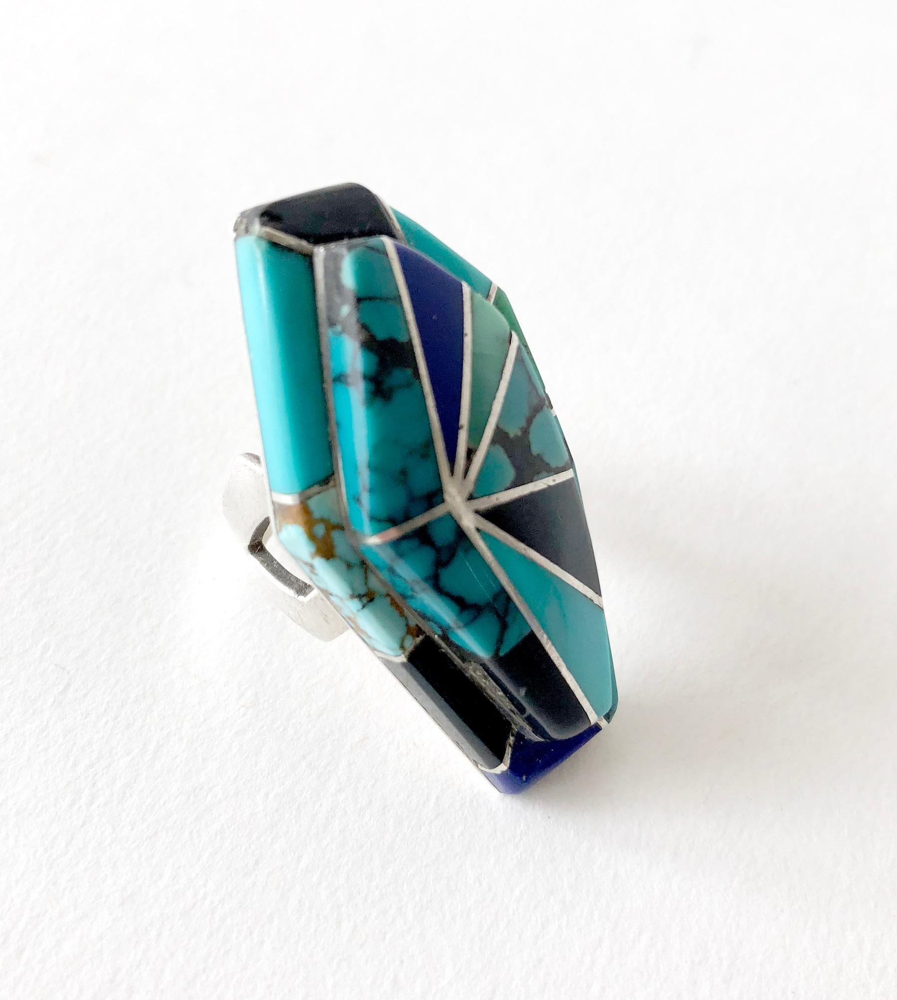 Custom made ring of turquoise, onyx and lapis lazuli inlaid in sterling silver and created by Richard Begay of Navajoland, Arizona.  Face of the ring measures 1.75