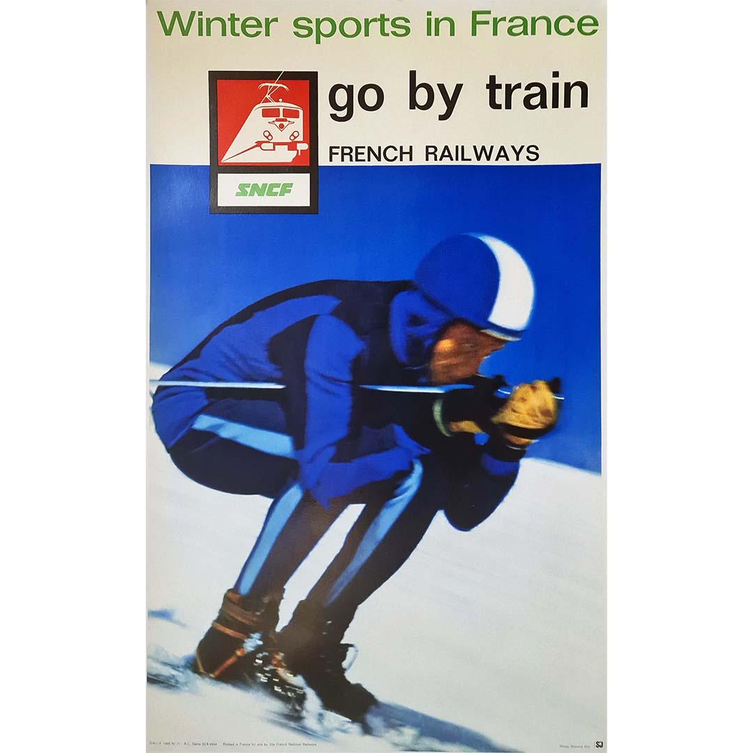 The original poster by Richard Blin for the SNCF (French National Railway Company) captures the allure of winter sports in France and promotes travel by train to these picturesque destinations. Blin's artwork, commissioned by the SNCF, exemplifies
