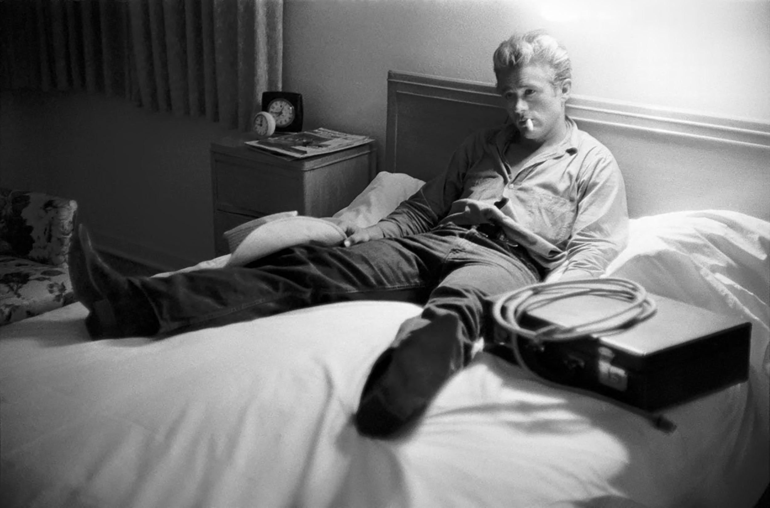Richard C. (Dick) Miller Black and White Photograph - James Dean Relaxing on the Bed During the Shooting of GIANT