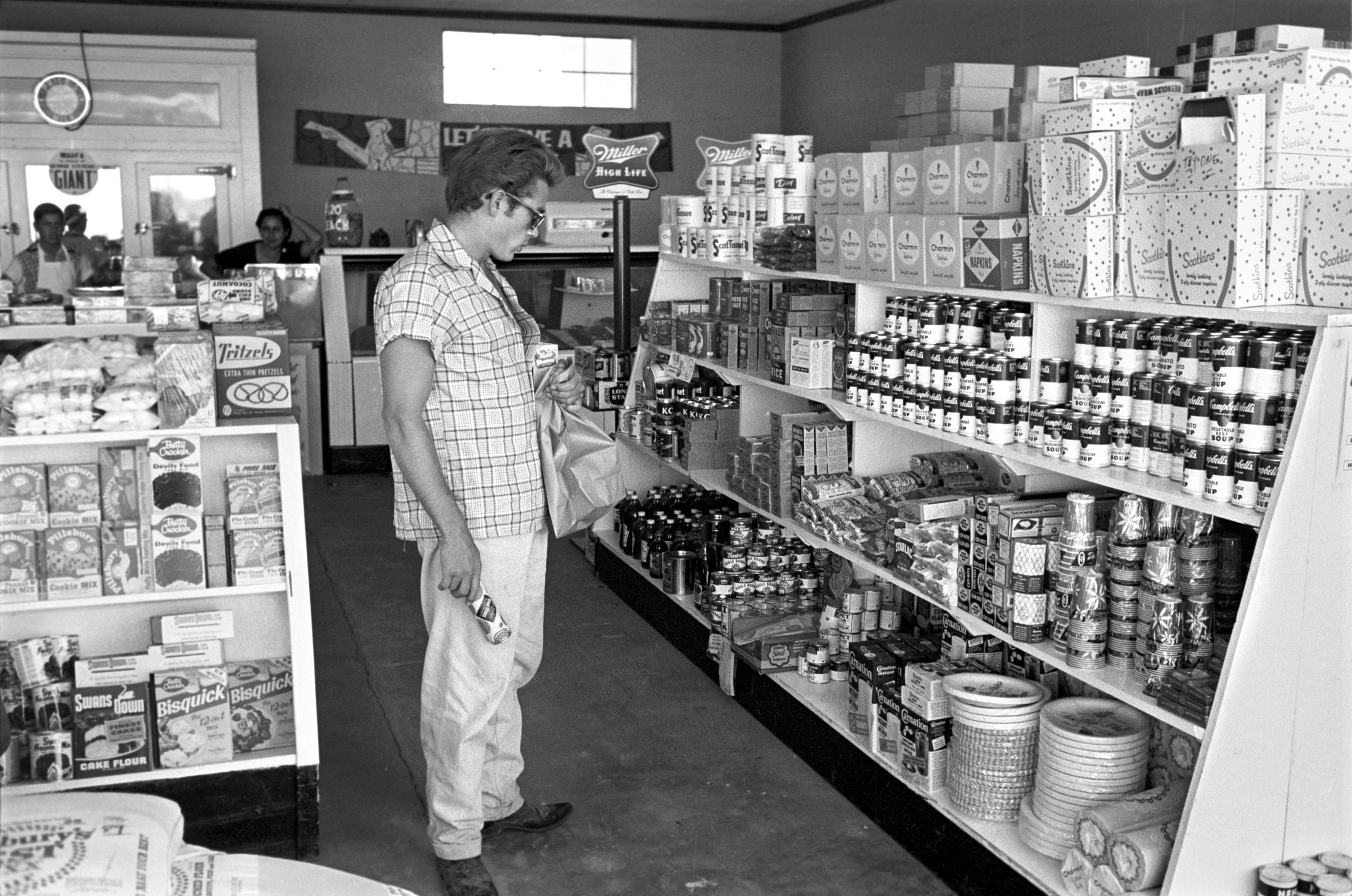 Richard C. (Dick) Miller Black and White Photograph - James Dean Visiting a Local Market During Shooting of GIANT
