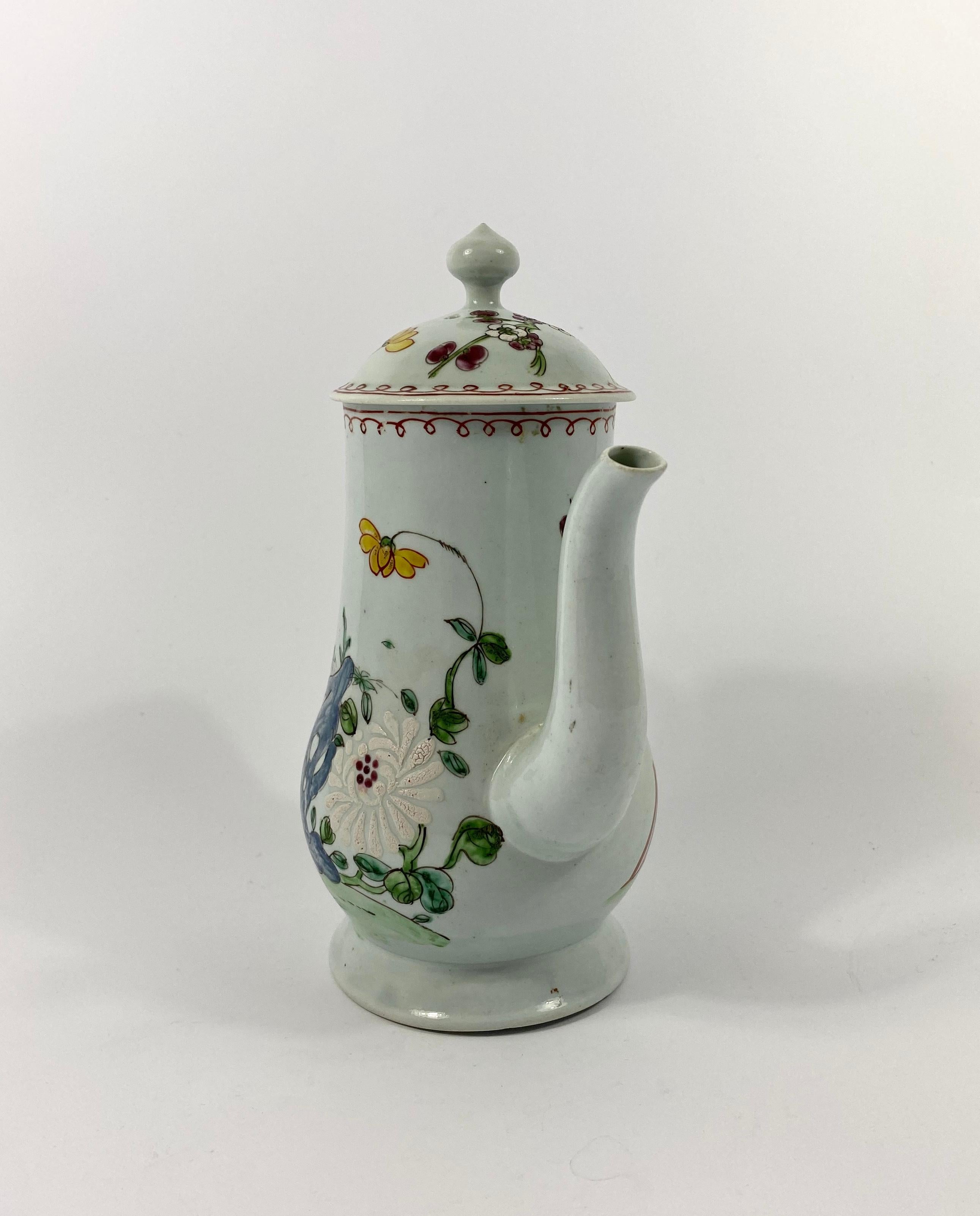 A fine and rare Richard Chaffers of Liverpool porcelain coffee pot and cover, circa 1758. The thinly potted and elegant small sized pot, hand painted in vibrant enamels, with flowering plants amongst rocks, and a fence, in Chinese Famille rose