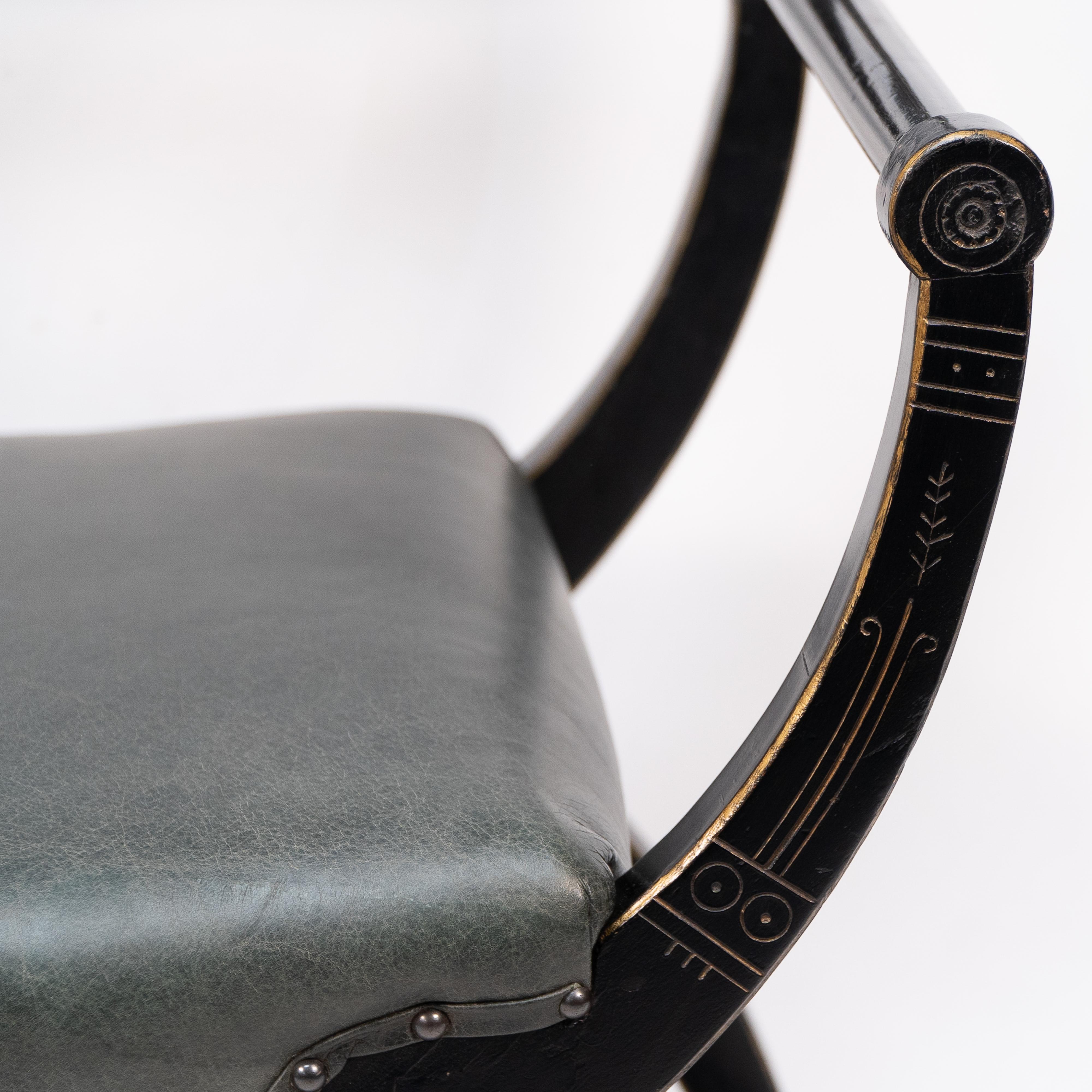 Wood Richard Charles Aesthetic Movement Ebonised Elbow Chair with X Frame stretcher For Sale