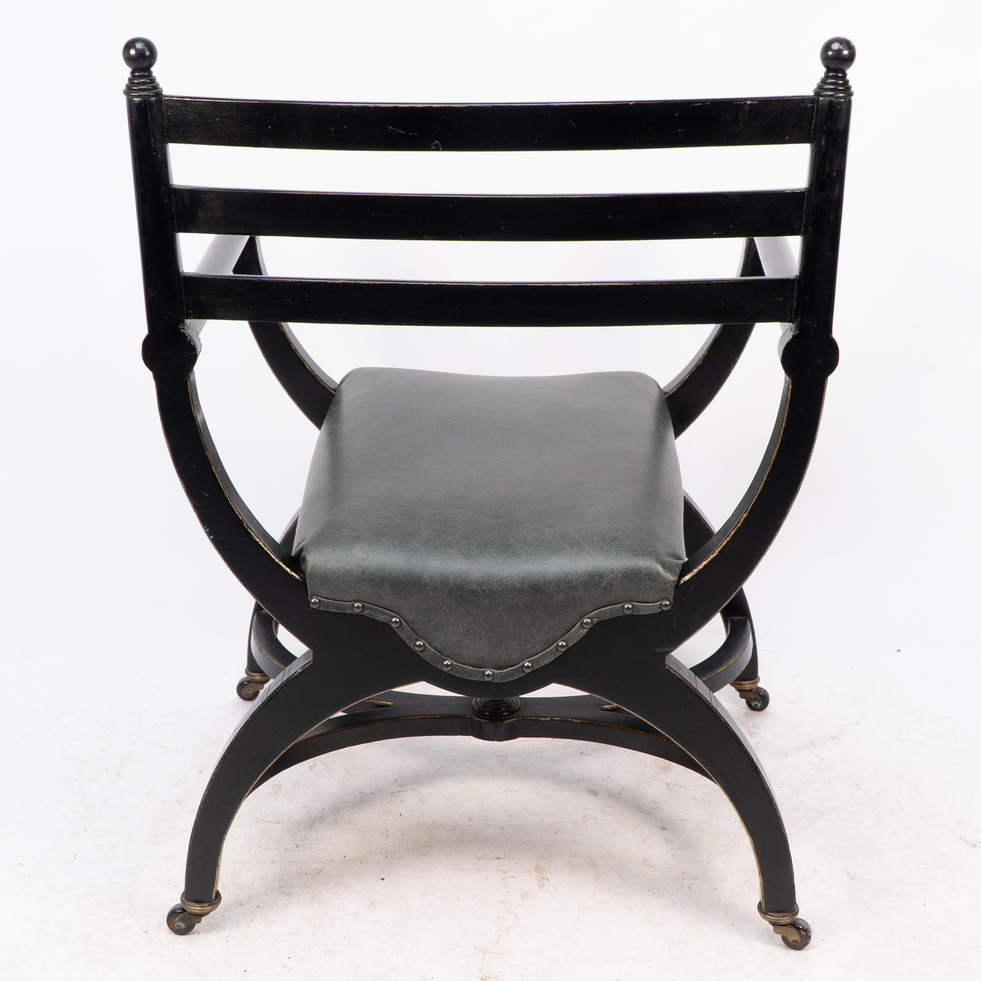 Richard Charles Aesthetic Movement Ebonised Elbow Chair with X Frame stretcher For Sale 8