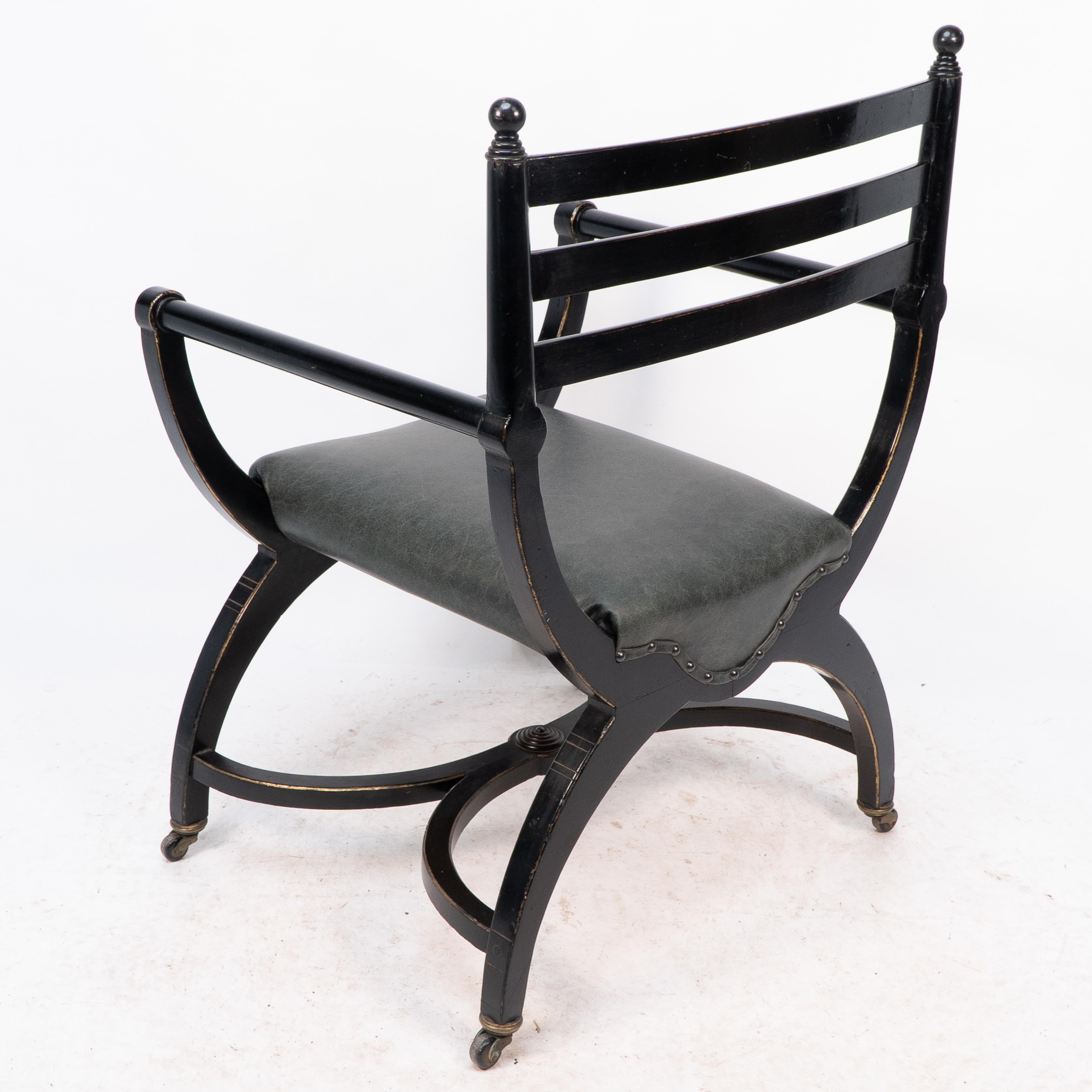 Richard Charles Aesthetic Movement Ebonised Elbow Chair with X Frame stretcher For Sale 9