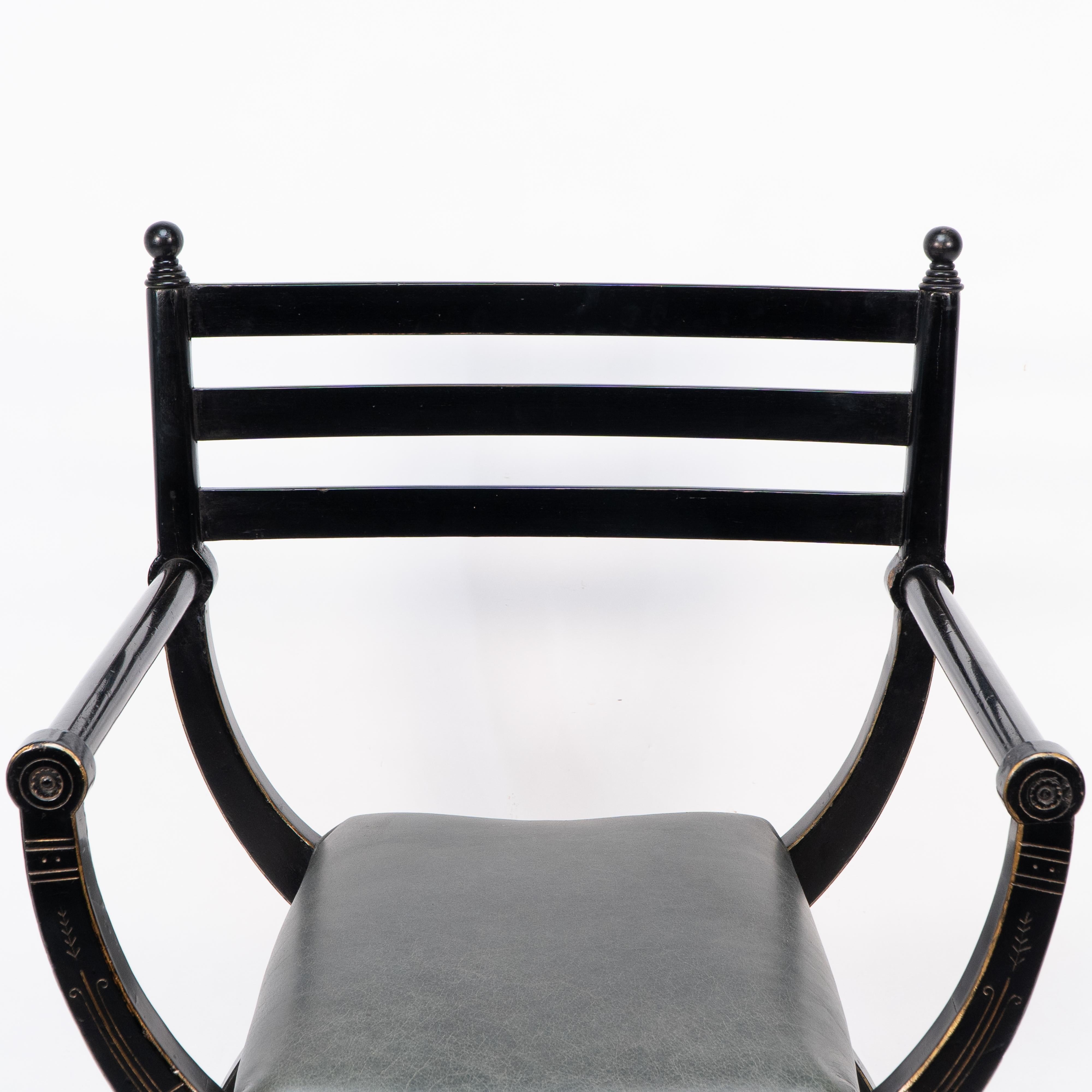 English Richard Charles Aesthetic Movement Ebonised Elbow Chair with X Frame stretcher For Sale