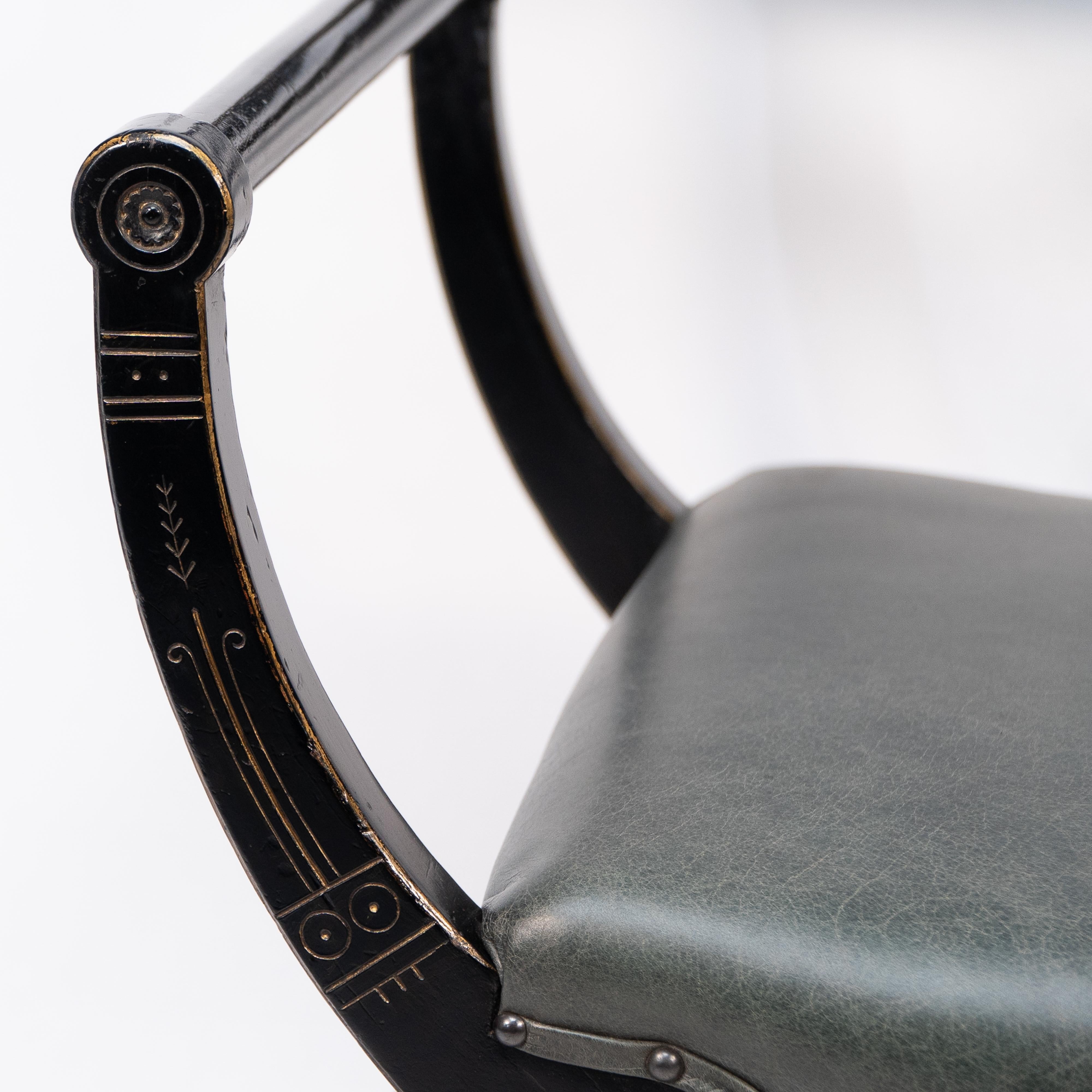 19th Century Richard Charles Aesthetic Movement Ebonised Elbow Chair with X Frame stretcher For Sale