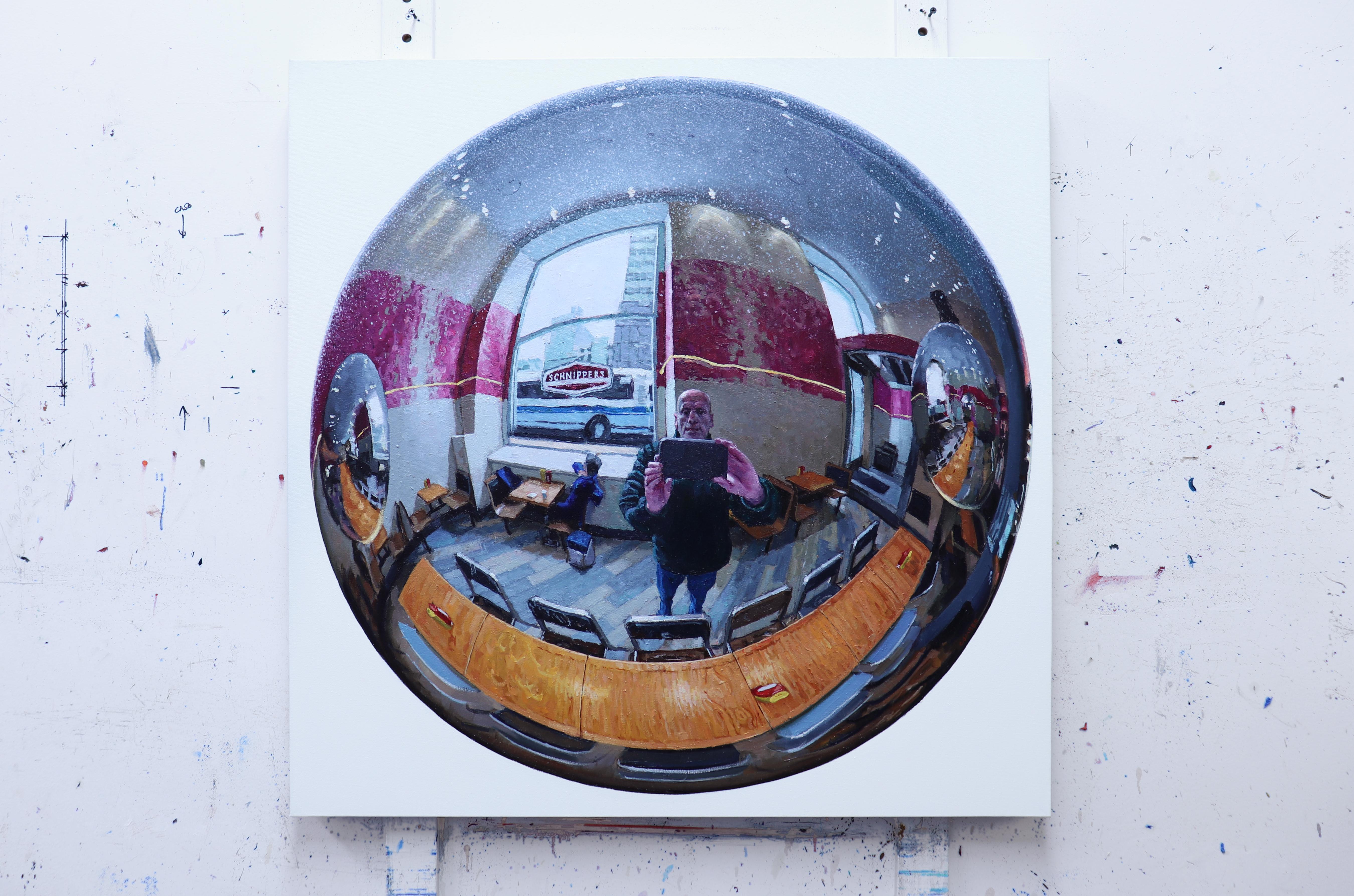 Fascinated by the reflections in common, everyday objects, Richard Combes reinvents the act of the selfie by depicting himself and his cell phone in the convex mirror of a restaurant's light fixture.