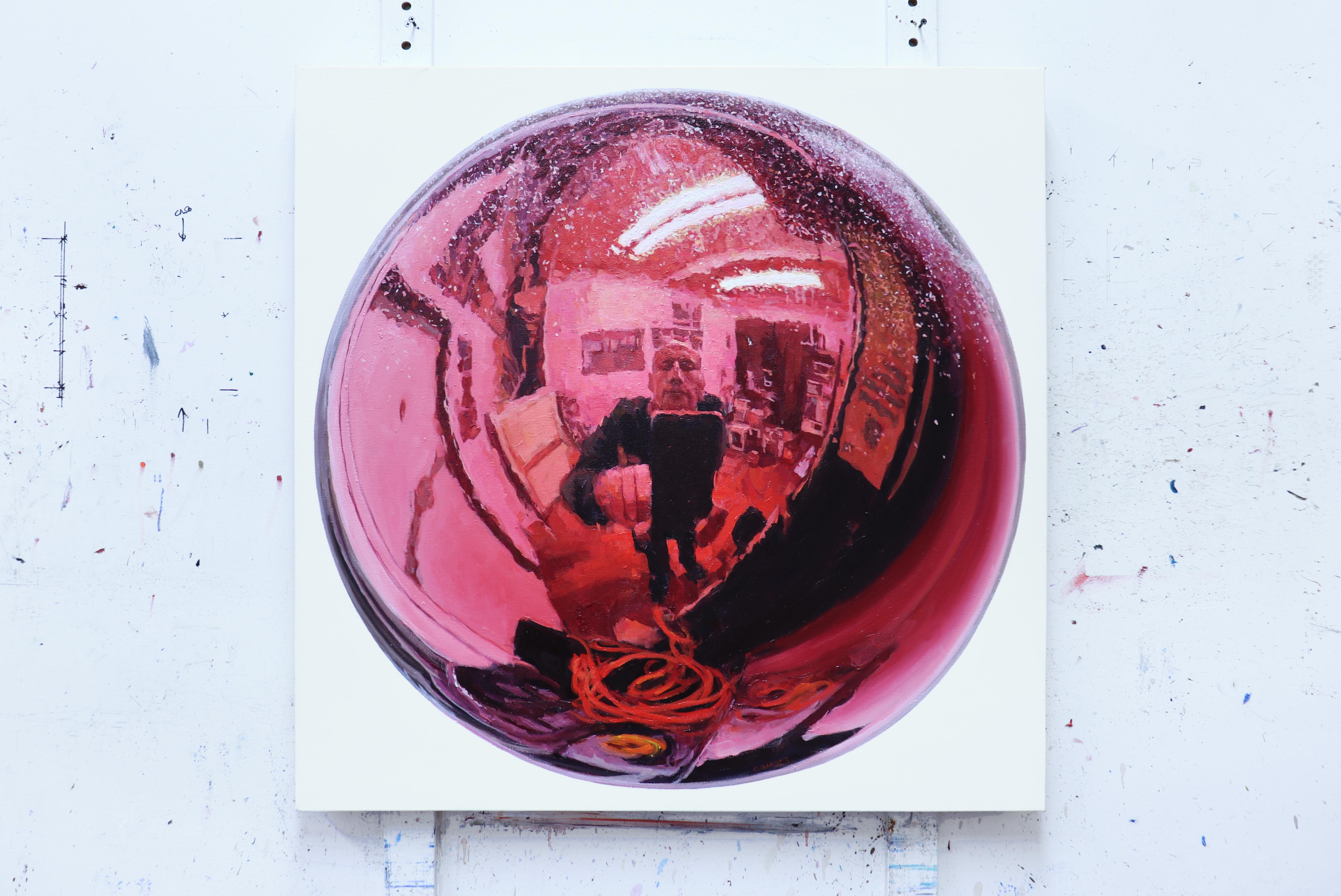 Fascinated by the reflections in common, everyday objects, Richard Combes reinvents the act of the selfie by depicting himself and his cell phone in the convex mirror of a Christmas ornament.