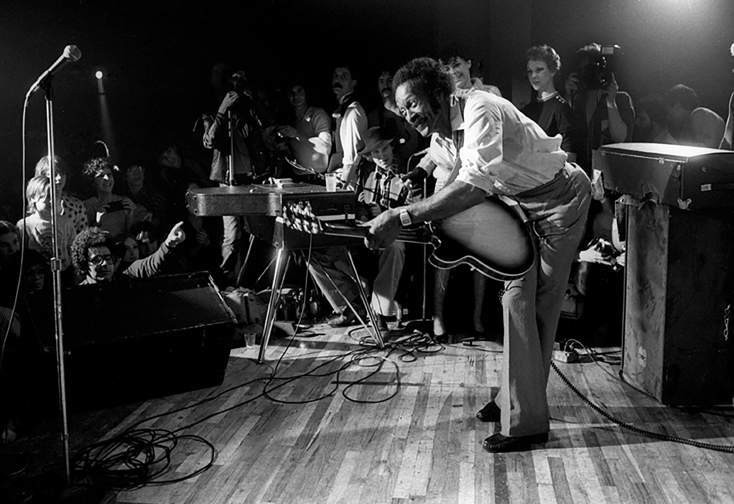 Richard E. Aaron Black and White Photograph - Chuck Berry Playing Guitar to Crowd