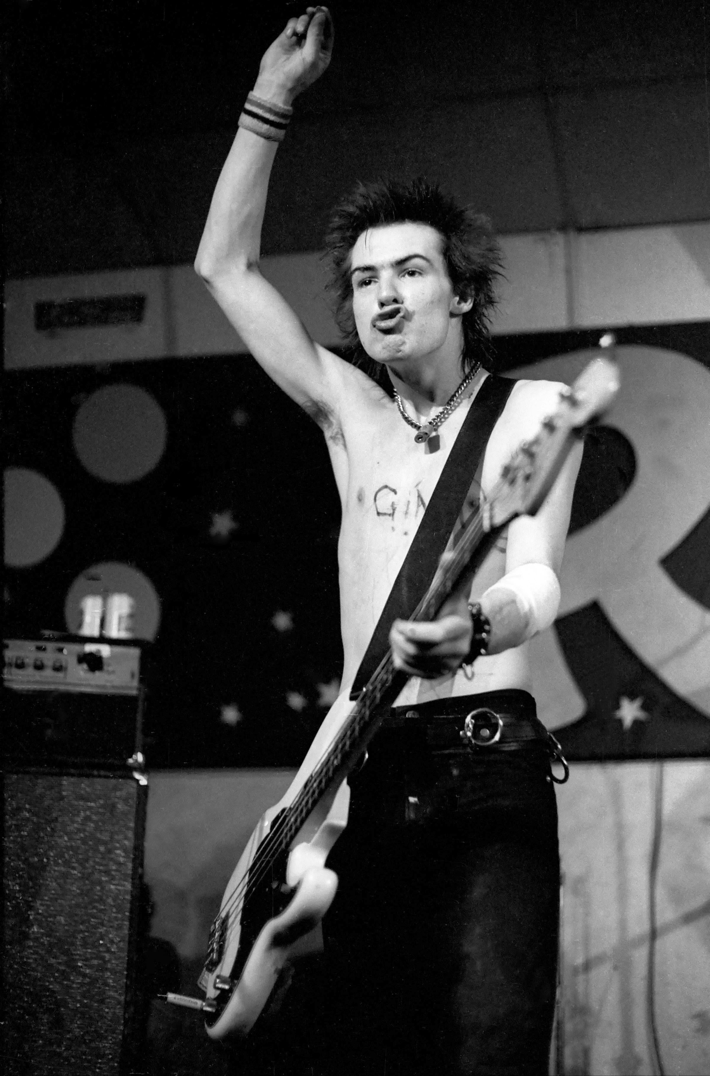 Richard E. Aaron Black and White Photograph - Sid Vicious Playing Guitar 1978