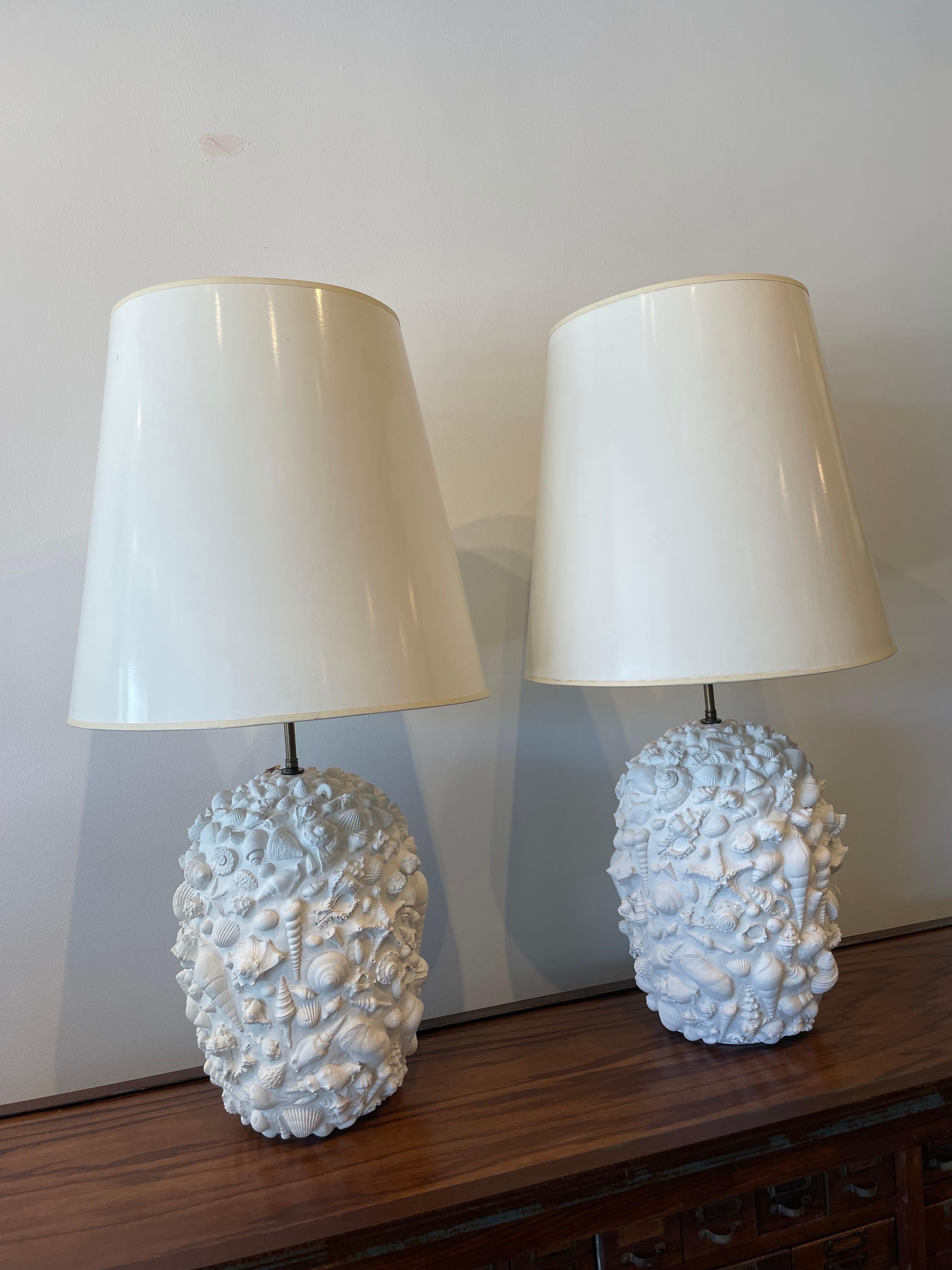 Beautiful composite resin tall lamps with hundreds of seashells and marine details throughout.  Beautiful and whimsical while maintaining their elegance and classic beach look.

NOTE: Shades are normally not included and are for photography purposes