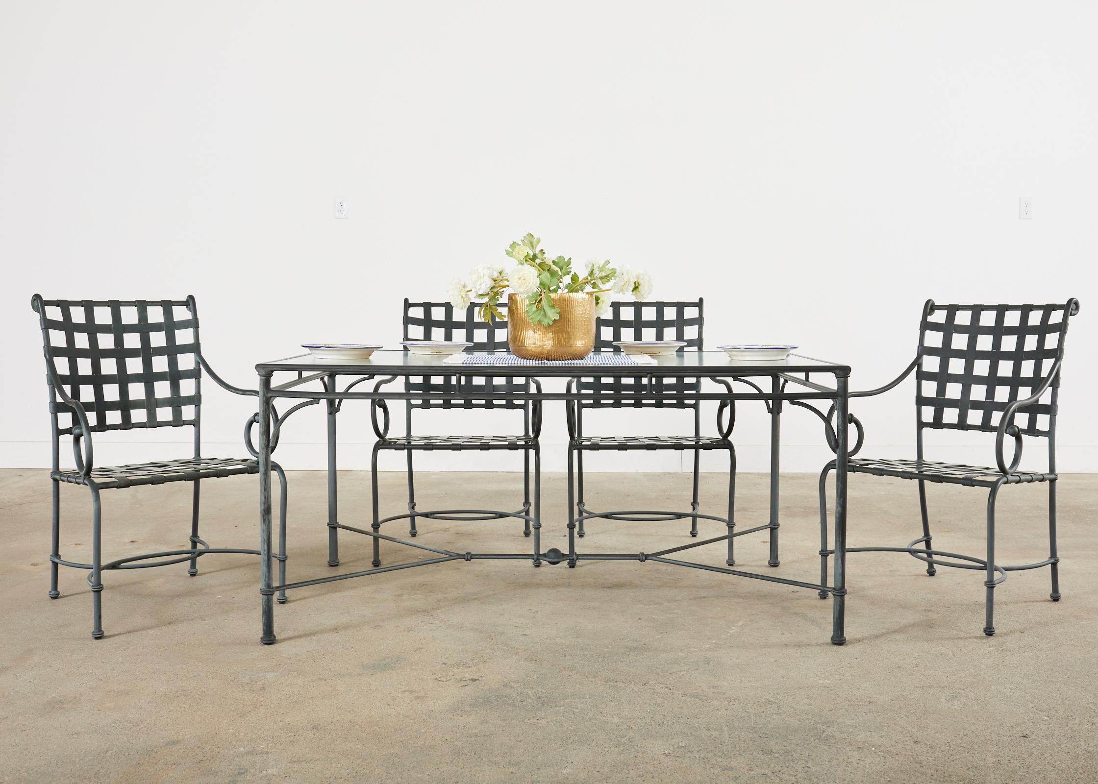 Rare labeled seven piece set of Richard Frinier designed for Brown Jordan patio and garden dining suite consisting of six Florentine aluminum dining armchairs and matching rectangular garden dining table. Purchased from the original owners each