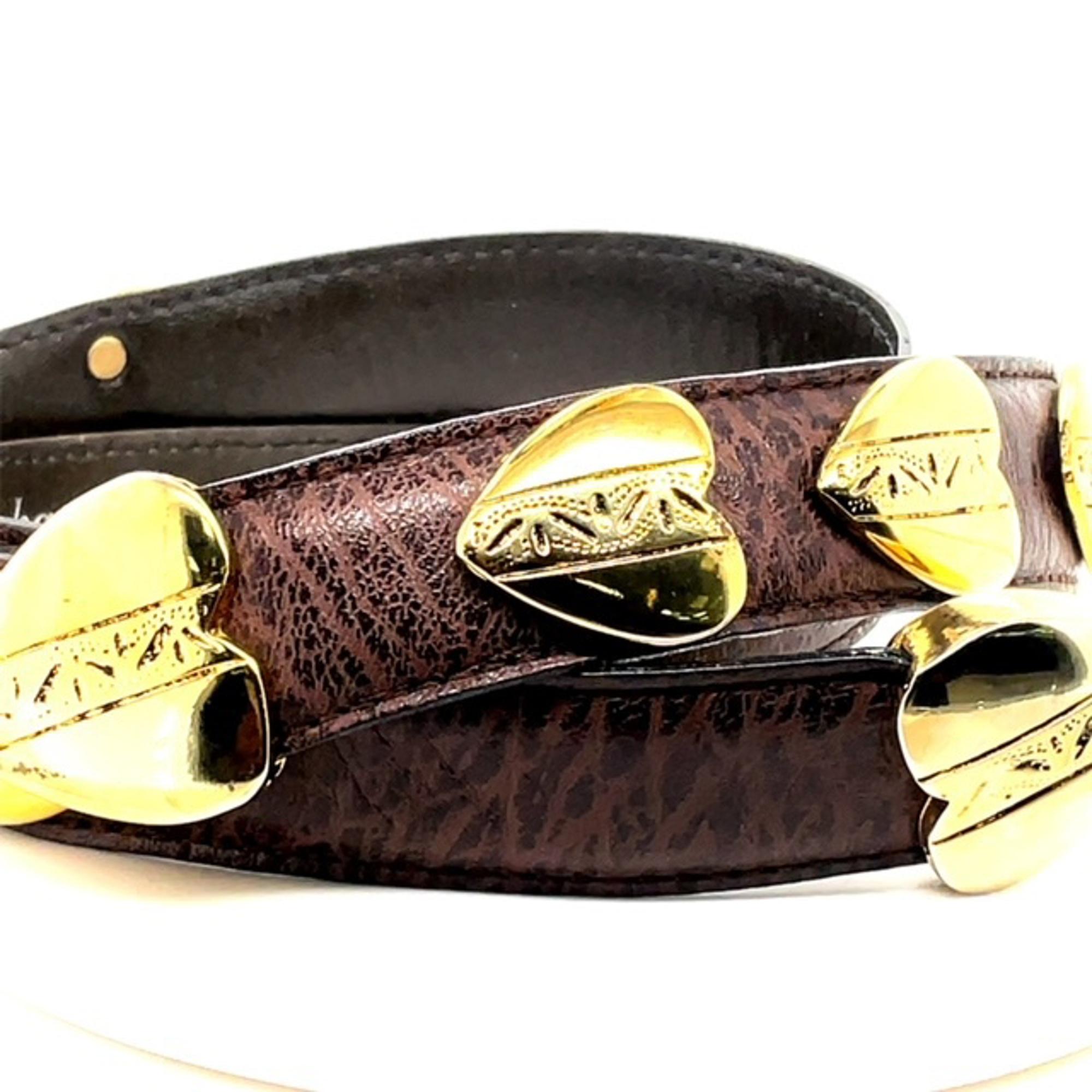 Richard Gampel brown leather belt with nine gold tone heart shaped detailed charms that slide along the belt. The vintage heart buckle charms come in gold tone hardware with a brown leather belt. The buckle and belt back are marked with the brand