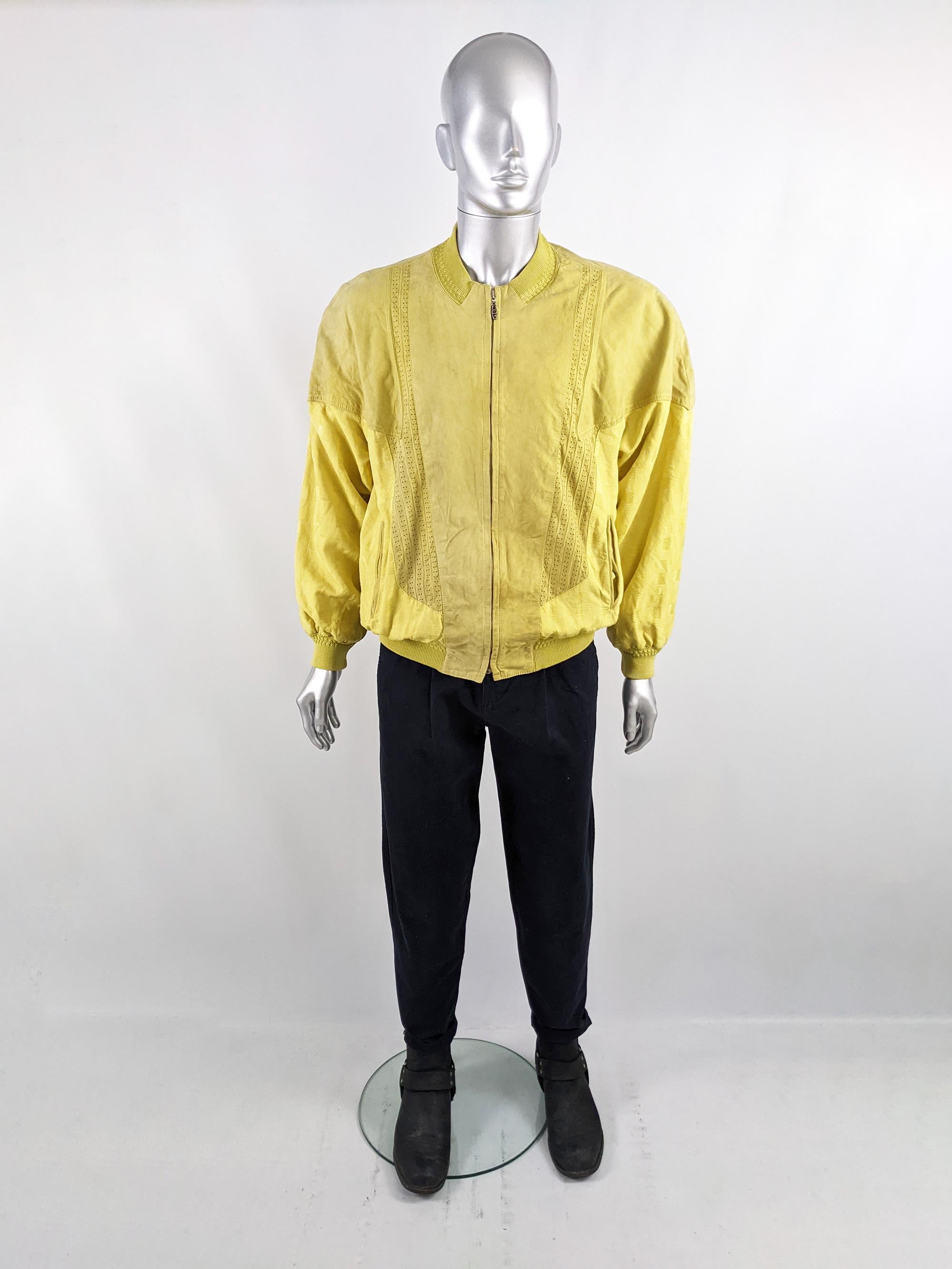 An incredible and rare vintage mens bomber jacket from the 80s by luxury British menswear store, Richard Gelding - of London's exclusive Mayfair. In a yellow pure silk fabric with a jacquard weave and yellow suede on the front and around the back