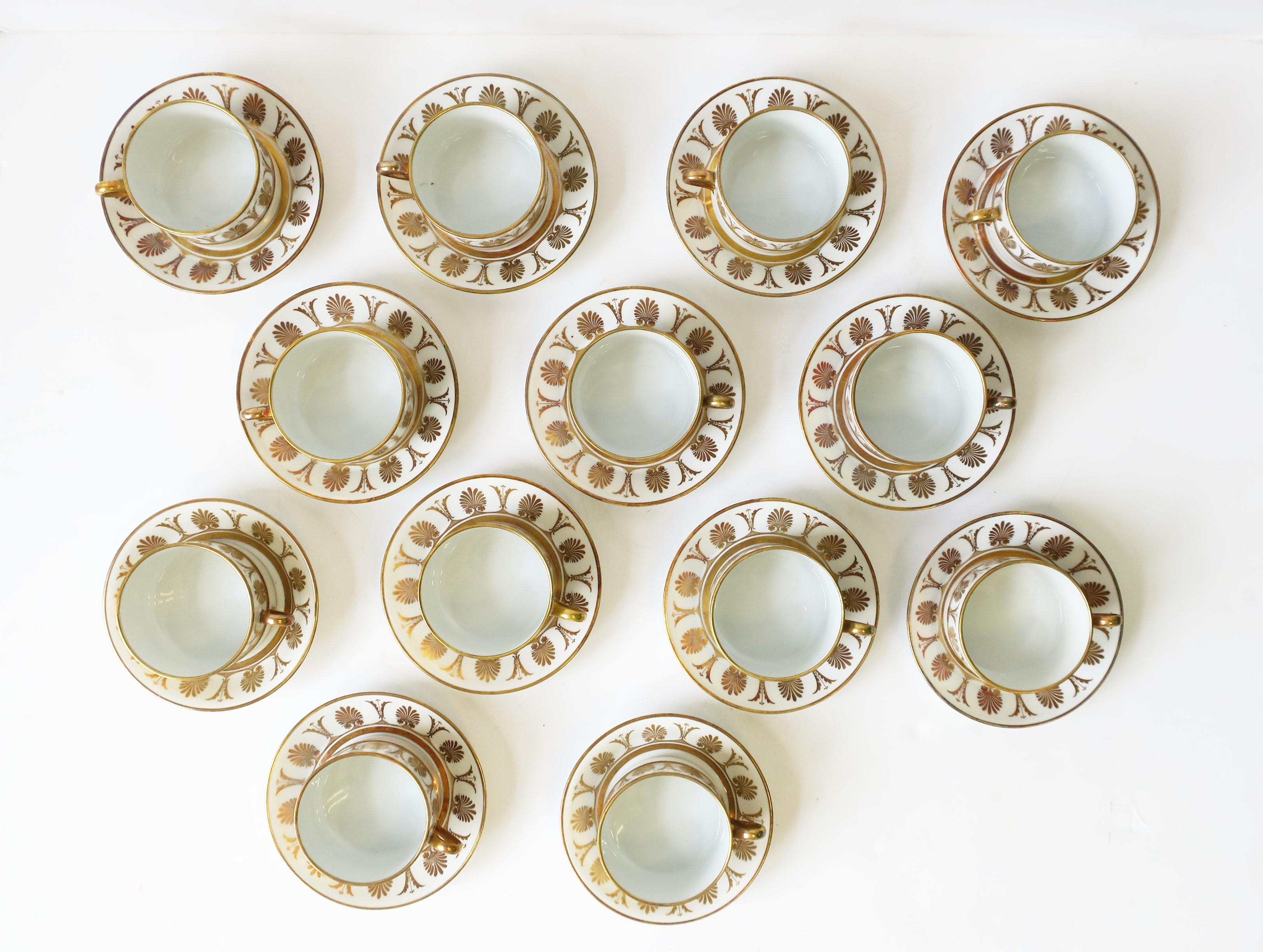 A very beautiful vintage set of 12 Italian designer white porcelain with gold coffee or tea cup and saucer set by Richard Ginori, Italy, circa mid-20th century, 1960s. Colors include: gold on white porcelain. All with maker's mark on bottom: