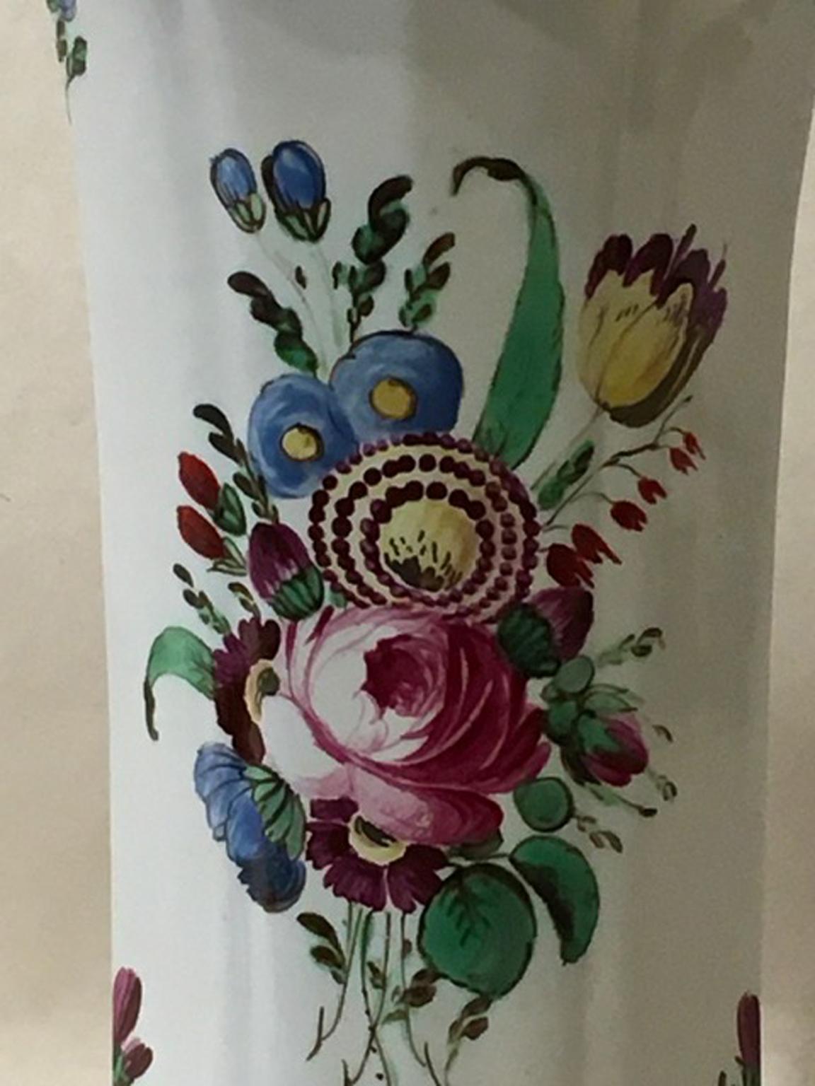 This elegant vase was produced by Richard Ginori porcelain manufacturer in Doccia, Italy, in the 1730 
Not easy to find this model so fine and elegant with its country flowers in pink, blue and yellow tulips.
A piece that can be part of a worth