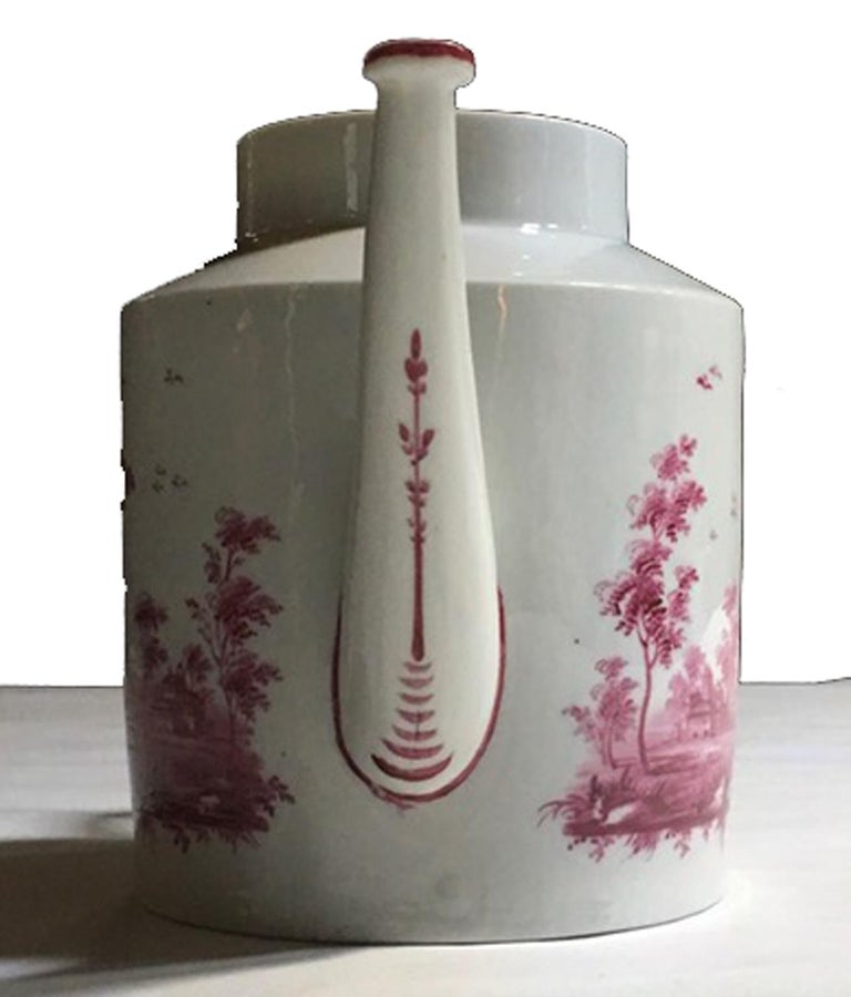 Richard Ginori Late 18th century porcelain tea pot with hand painted landscapes

This very elegant tea pot was hand painted with views of Italian contrysides landscapes, in fuchsia color.
Floral decoration on the lid and on the spout.
With