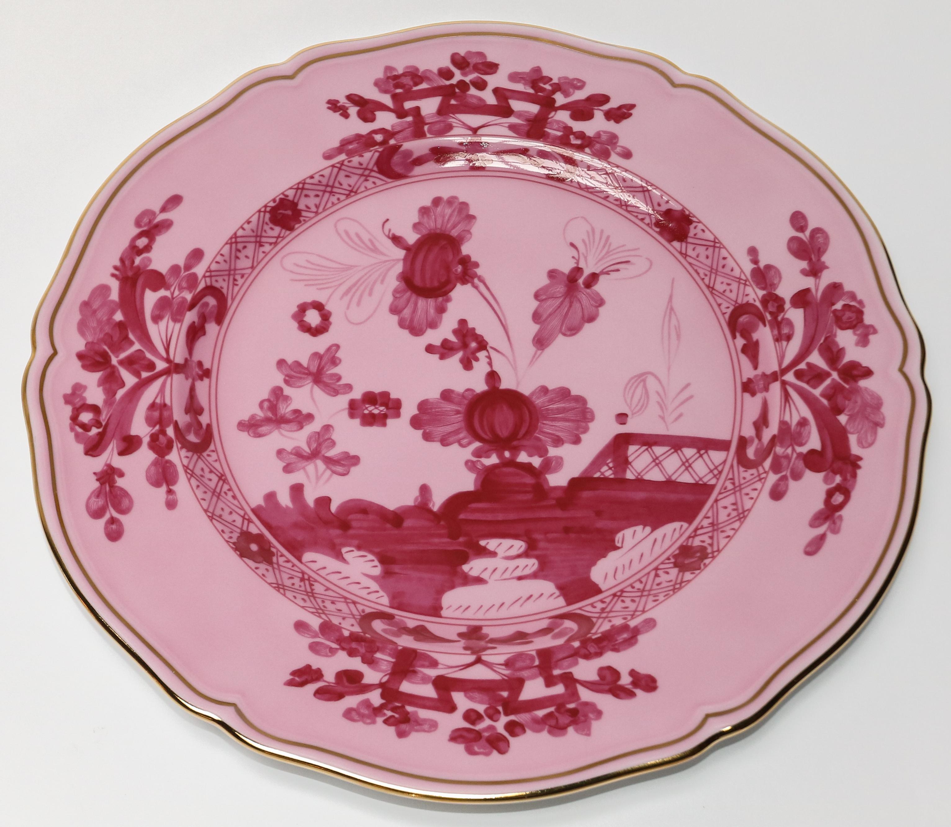Richard Ginori Oriente Italiano porpora pink charger plate in the Antico Doccia shape 31cm in diameter.
  
