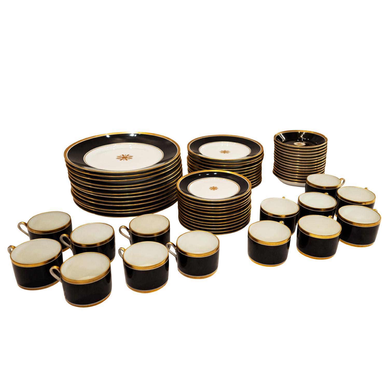 Rare refined and visually stunning 64 piece set of service ware, fine porcelain in white, black and gold by Richard Ginori, Italy 1950's (signed).  The black and gold set together are extremely rich and luxurious.  There are no chips or cracks. 