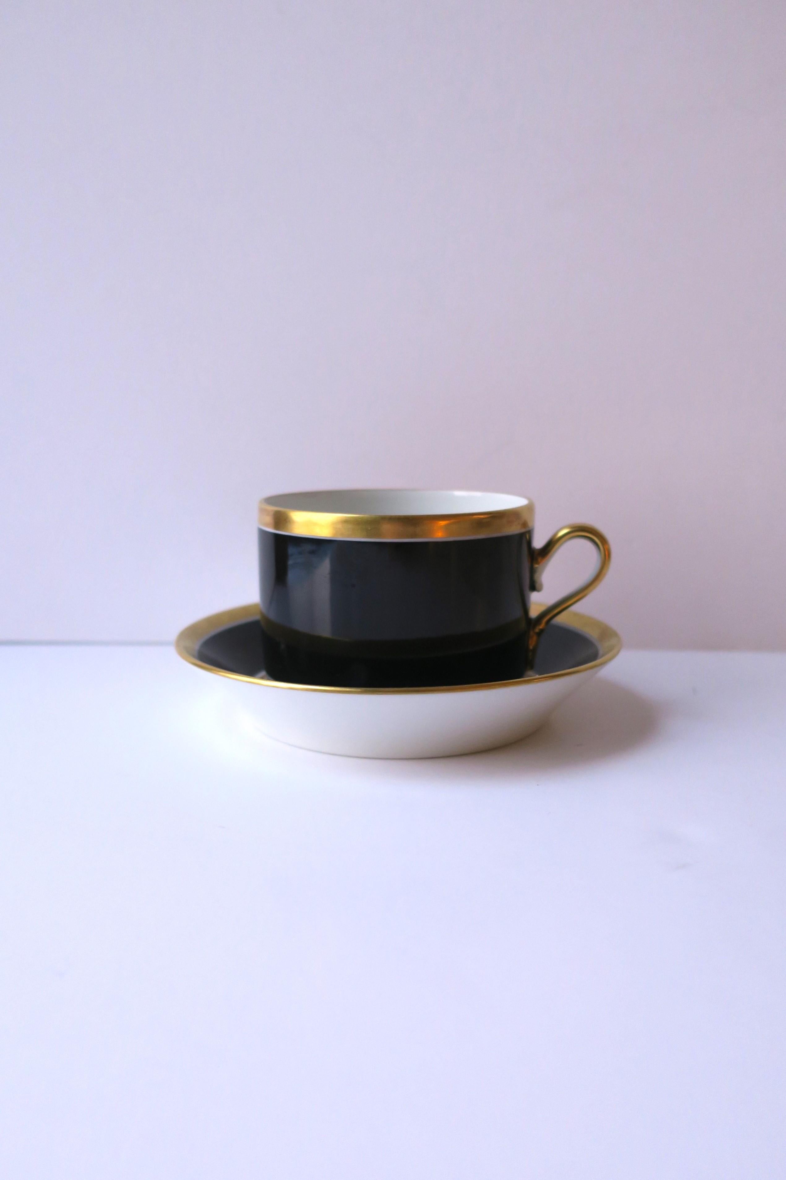 A beautiful and elegant Italian black and gold porcelain coffee or tea cup and saucer by designer Richard Ginori, circa mid-20th century, 1960s, Italy. With maker's mark on bottom of both as shown in last two images. Excellent condition as shown in