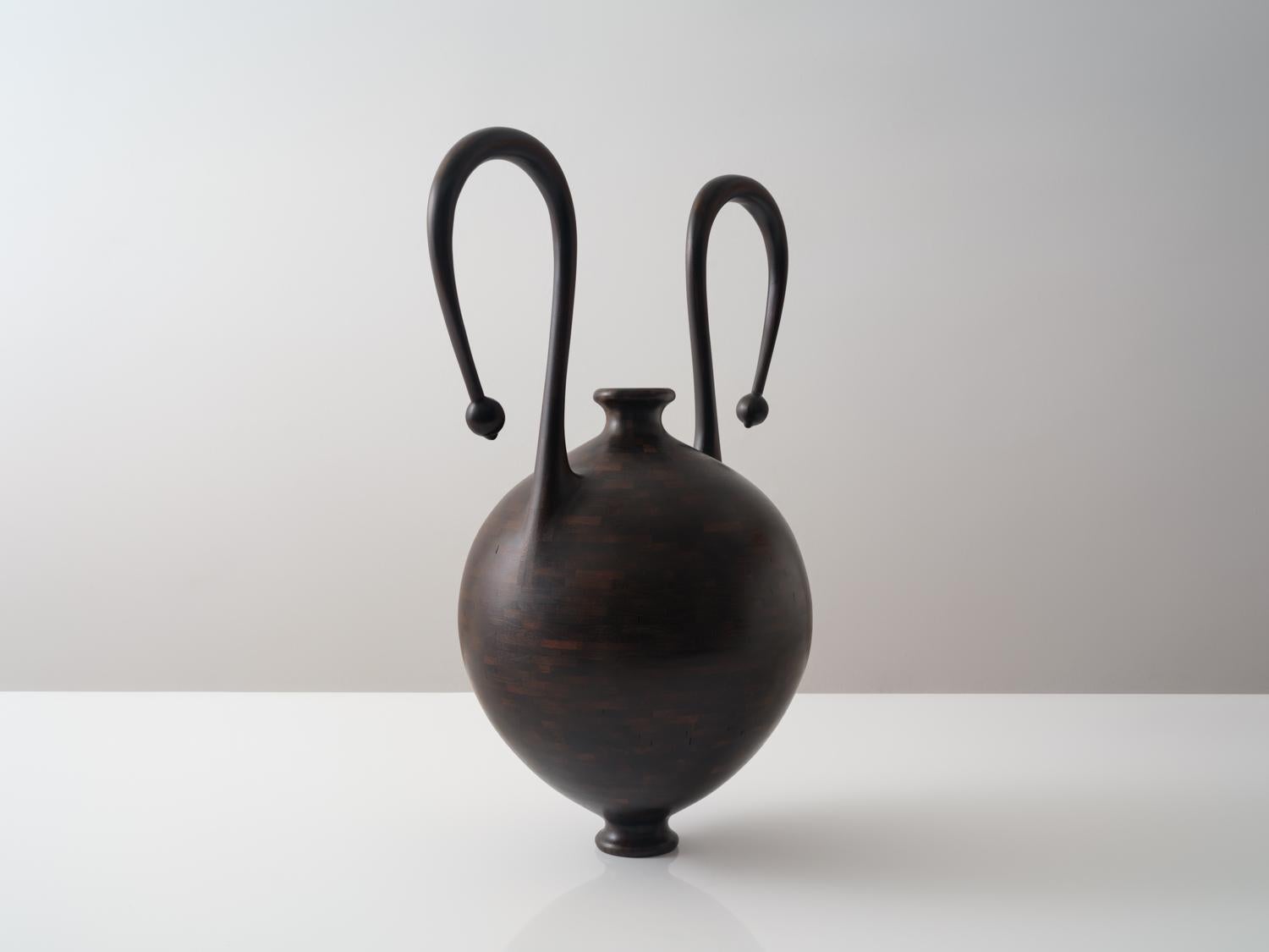 This vessel is made of salvaged Cherry, with an oxidized finish. 

Richard’s work is driven by the concept of renewal—transforming salvaged materials into functional & decorative art that embodies beauty, craftsmanship, & environmental mindfulness. 