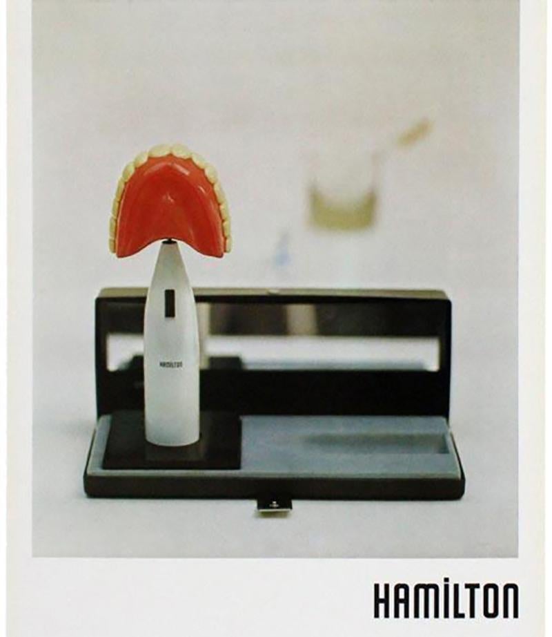 This poster was produced in 1973 to promote a Richard Hamilton exhibition at the Davison Art Center, Wesleyan University, Middletown, Connecticut, USA.  The poster reproduces The critic laughs 1971−2 which consists of the white barrel of an electric