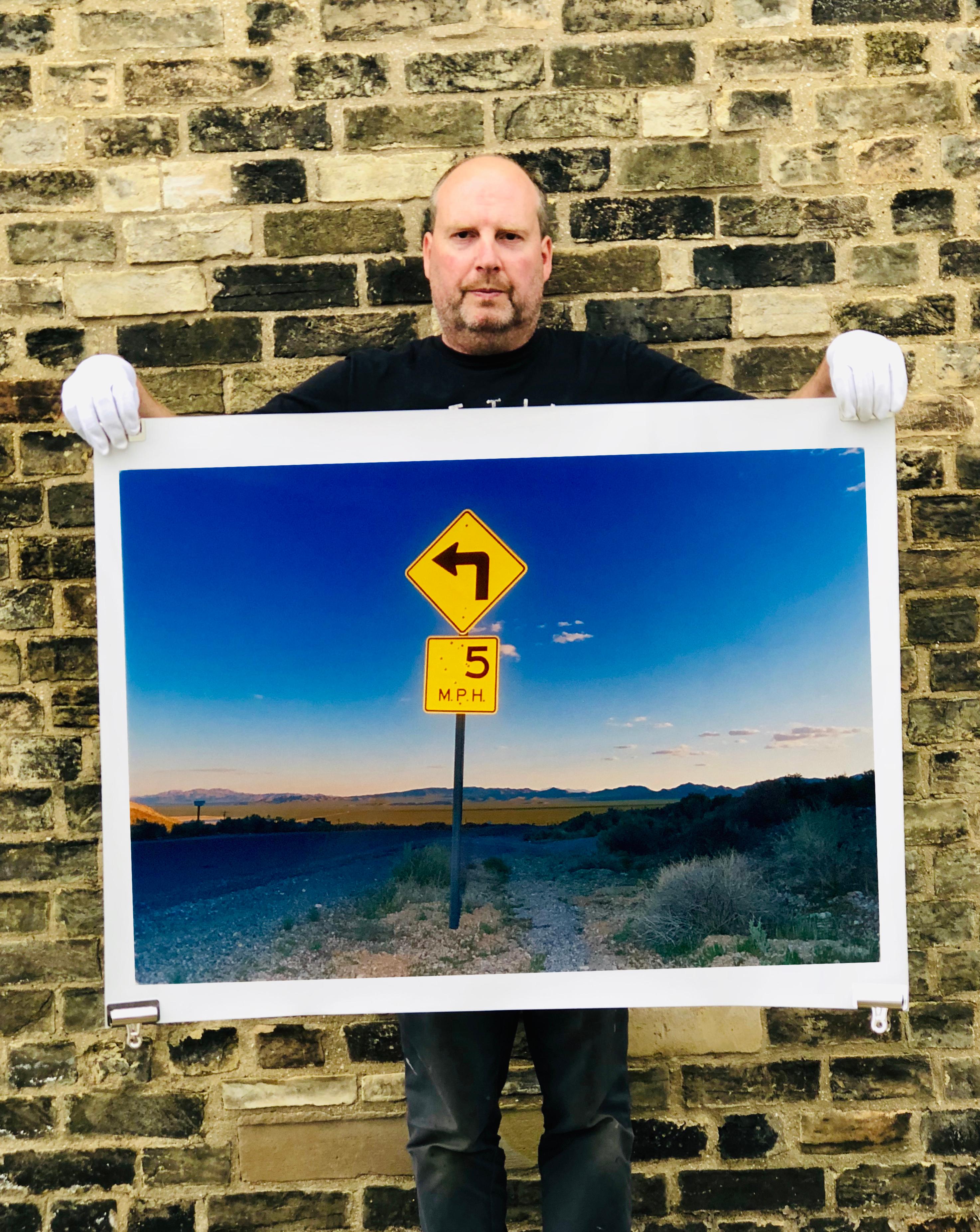 Part of Richard Heeps 'Dream in Colour' Series, this beautiful dusk picture captures the sunset in the valley.  It was photographed in what was once a goldmine, now a ghost town. The sign, 5MPH is so cautious but on closer inspection the sign is