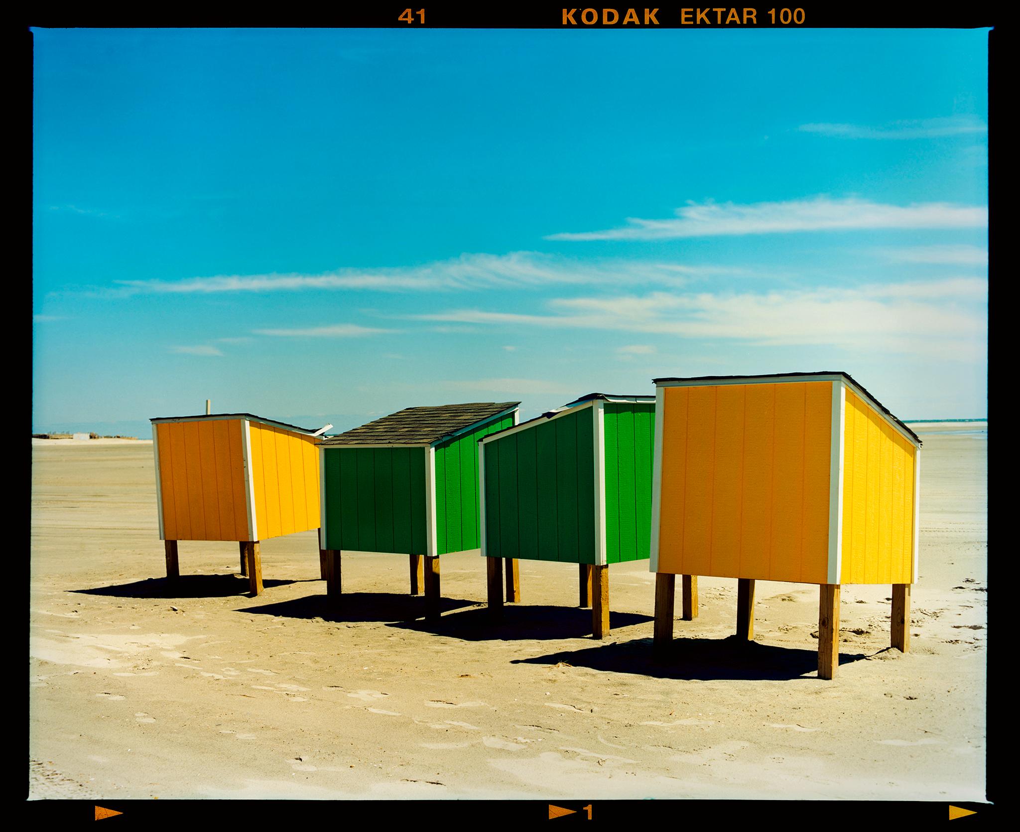 Wildwood beach lockers captured on a glorious spring blue sky day. Taken in 2013 this picture was first executed in Richard's darkroom in April 2020. Colour is key in Richard's work and in the simplicity of this picture that really stands out.