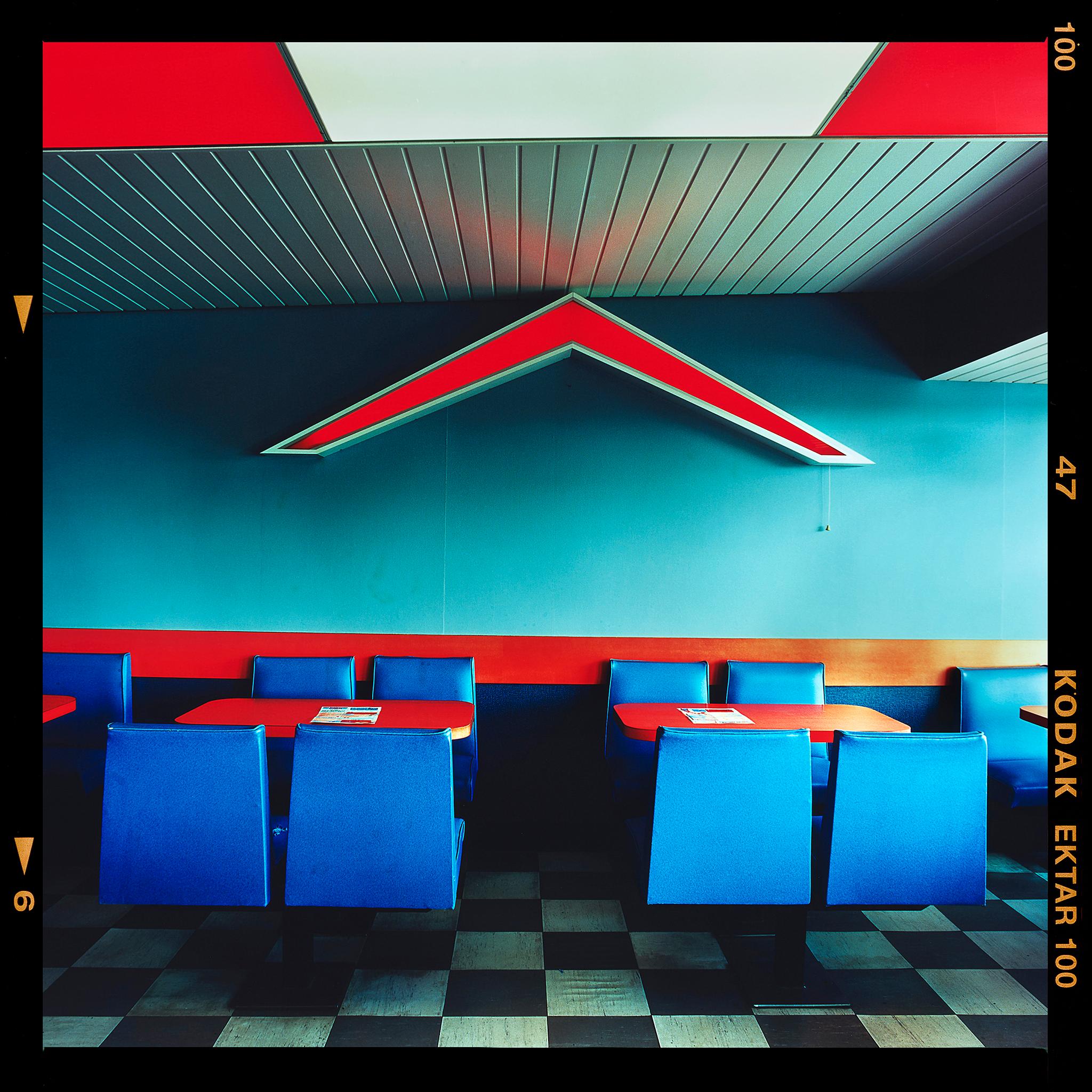 Chevron - Vintage Wimpy, Norfolk, 2023 photograph by Richard Heeps captures the style of an American diner, via Norfolk in England. The vintage interior has a sense of  nostalgia.

This artwork is a limited edition of 25 gloss photographic print
