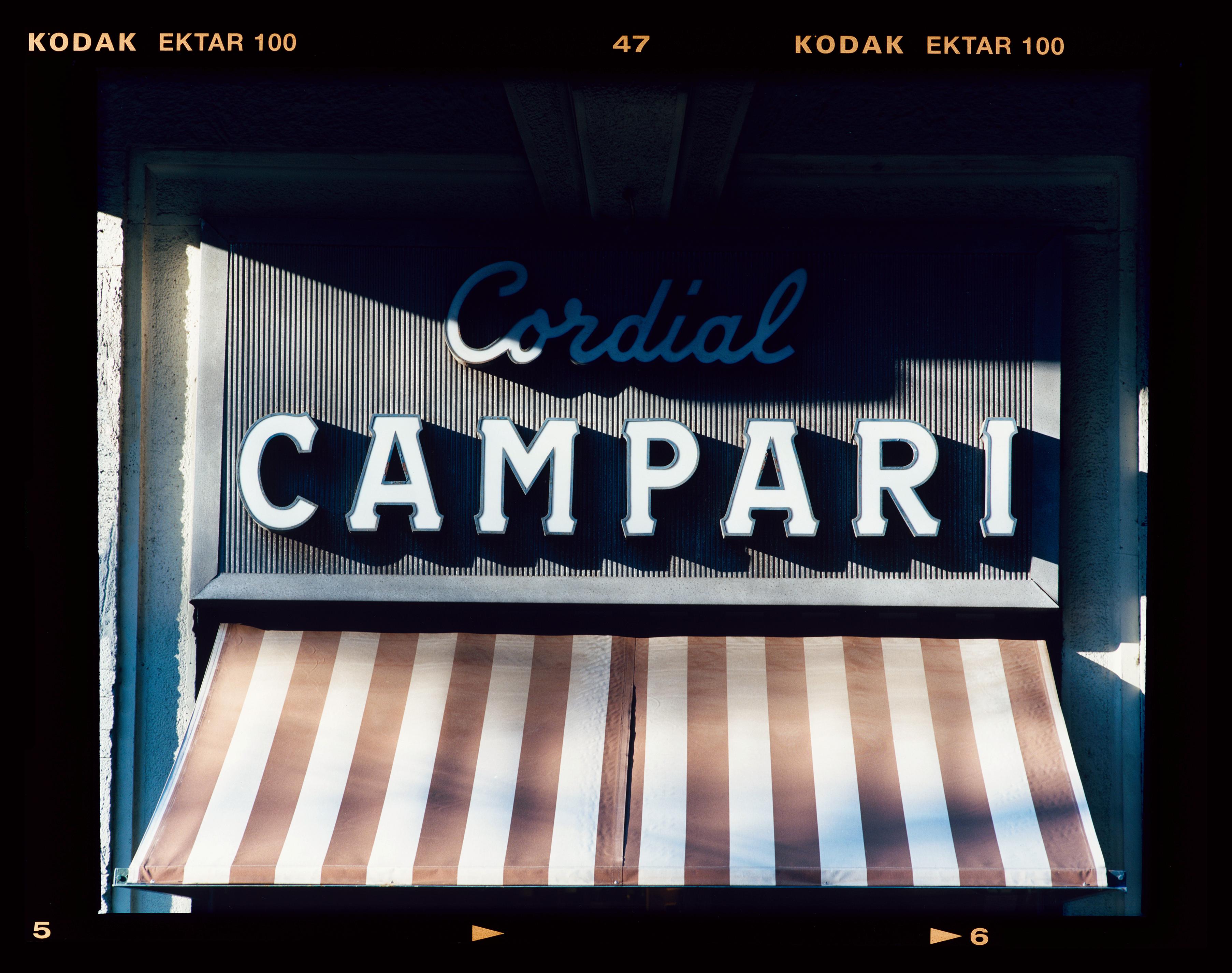 Cordial Campari, Italian street photograph from Richard Heeps series, A Short History of Milan.

There is a reoccurring linear, structural theme throughout the series, capturing the Milanese use of materials in design such as glass, metal, wood and
