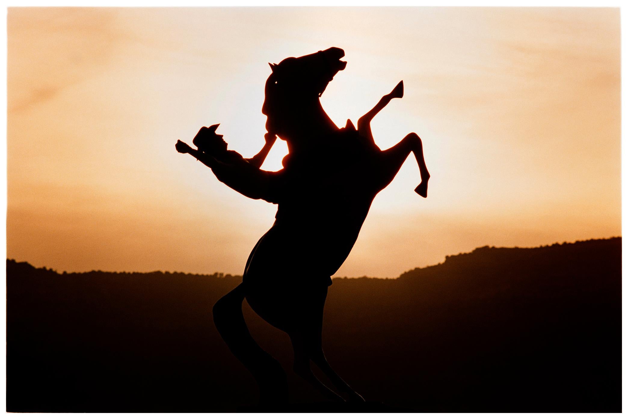 A Cowboy silhouette, captured in Kanab, the home of many Western Movies. This artwork is typical of one of Richard's signatures, a surreal twist using composition to play with reality.

This artwork is a limited edition of 25, gloss photographic