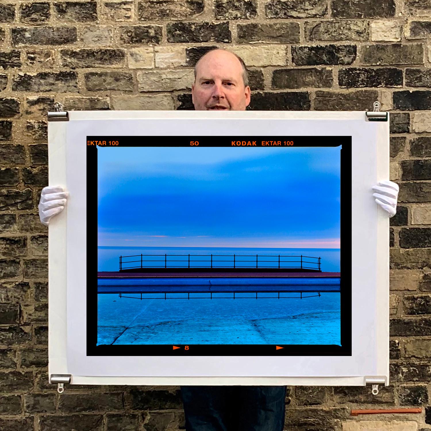 Craig y Don Pool Landscape, Llandudno - Shades of blue waterscape color photo - Photograph by Richard Heeps