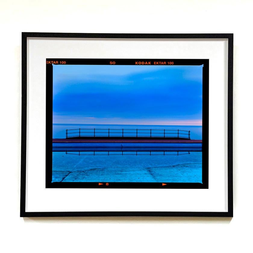 Craig y Don Pool Landscape, Llandudno - Shades of blue waterscape color photo - Contemporary Photograph by Richard Heeps