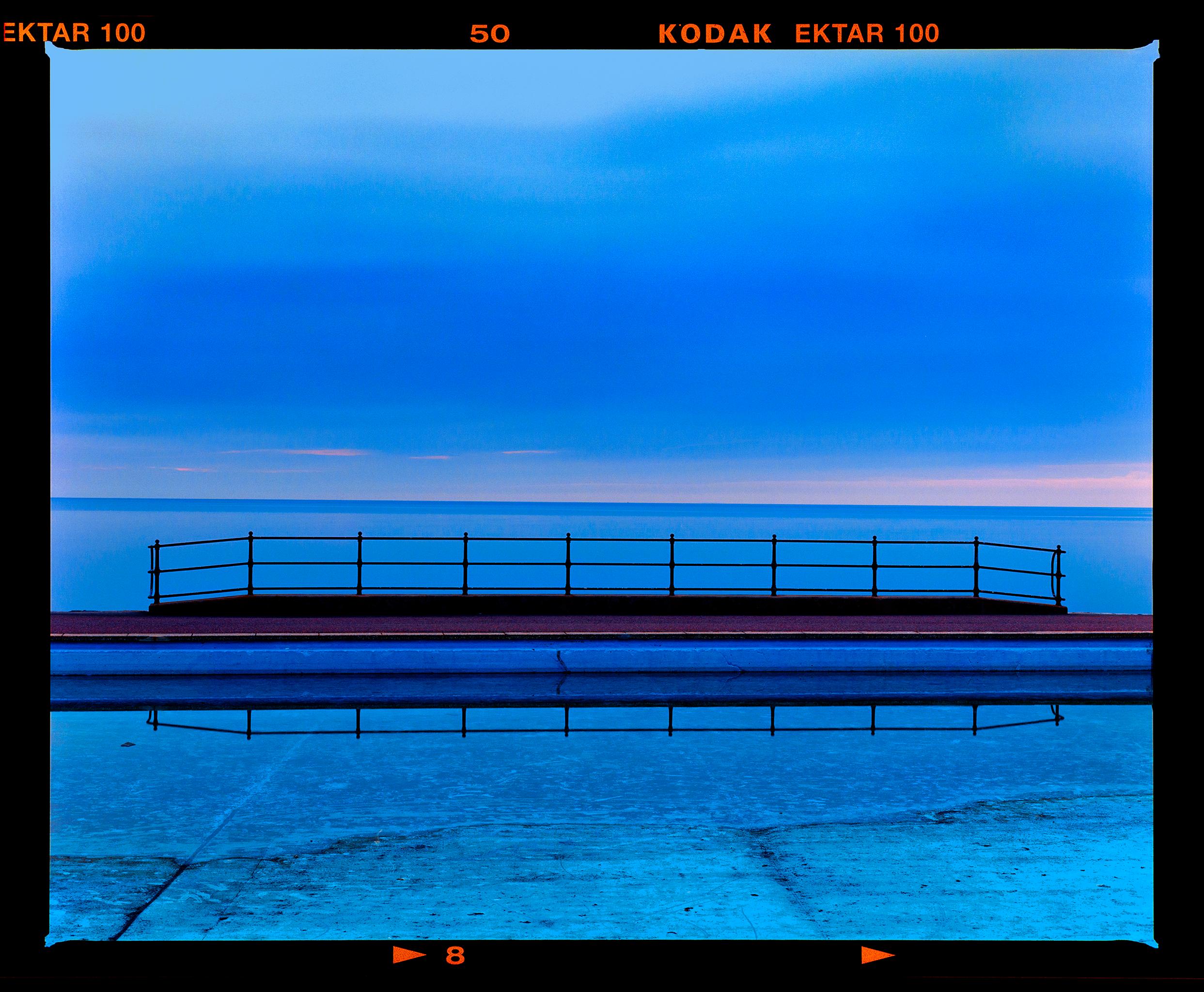 Richard Heeps Landscape Photograph - Craig y Don Pool Landscape, Llandudno - Shades of blue waterscape color photo