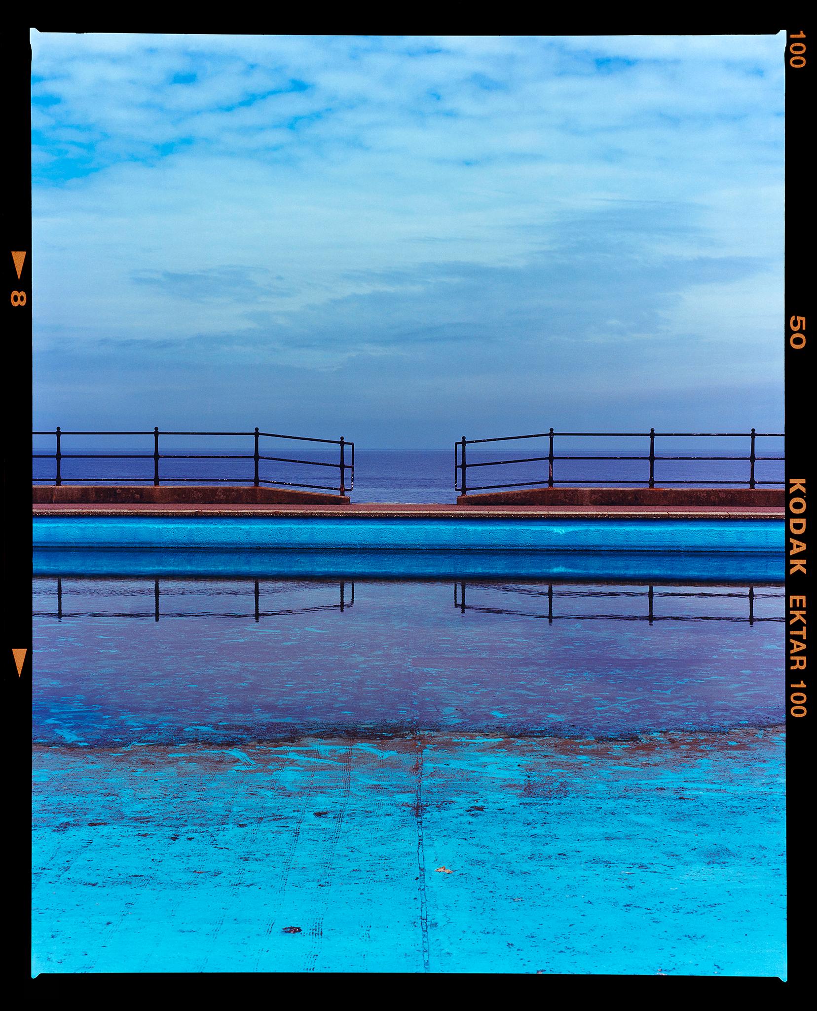 Richard Heeps Color Photograph - Craig y Don Pool, Llandudno Beach, Wales - Blue British Swimming Pool Sea Photo