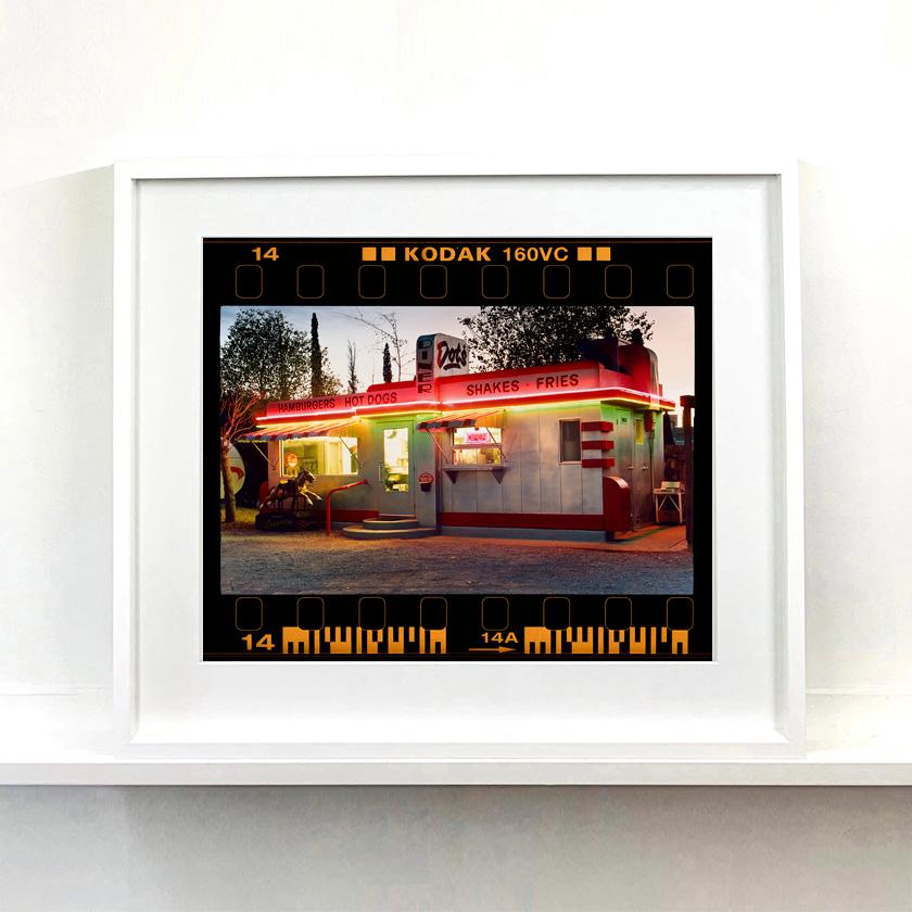 On the Road, reimagines classic Richard Heeps artworks presented with full film rebate almost like a blown up contact sheet. 
'Dot's Diner', photograph from Richard Heeps' 'Dream in Colour' series, featuring a classic American Diner in Bisbee,