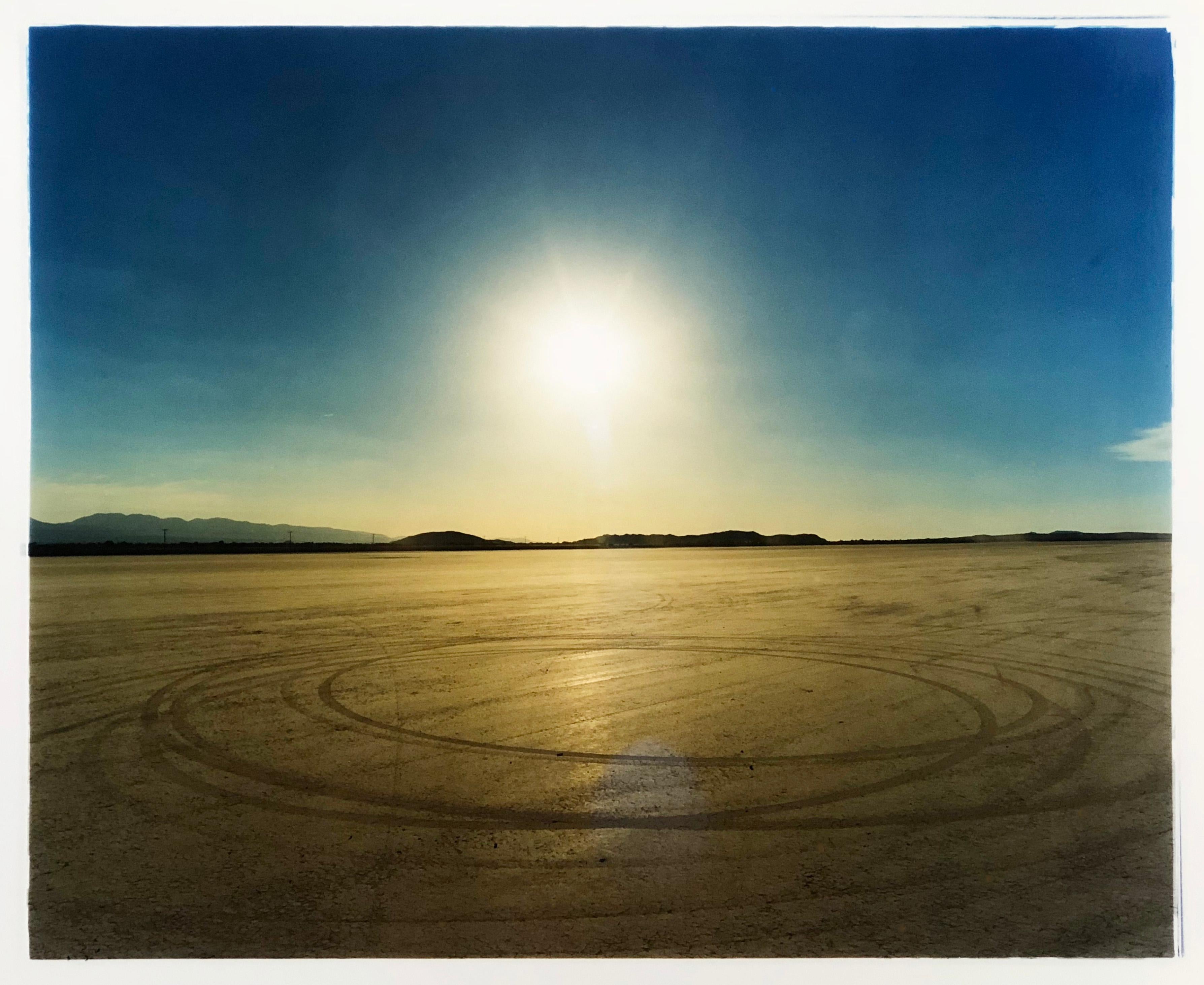 Photographed at El Mirage Lake, where the Southern Californian Timing Association,  Land Speed Racing event, tracks in the ground from the previous days racing, adding a beauty to the natural landscape. The scope of colors in this landscape in the