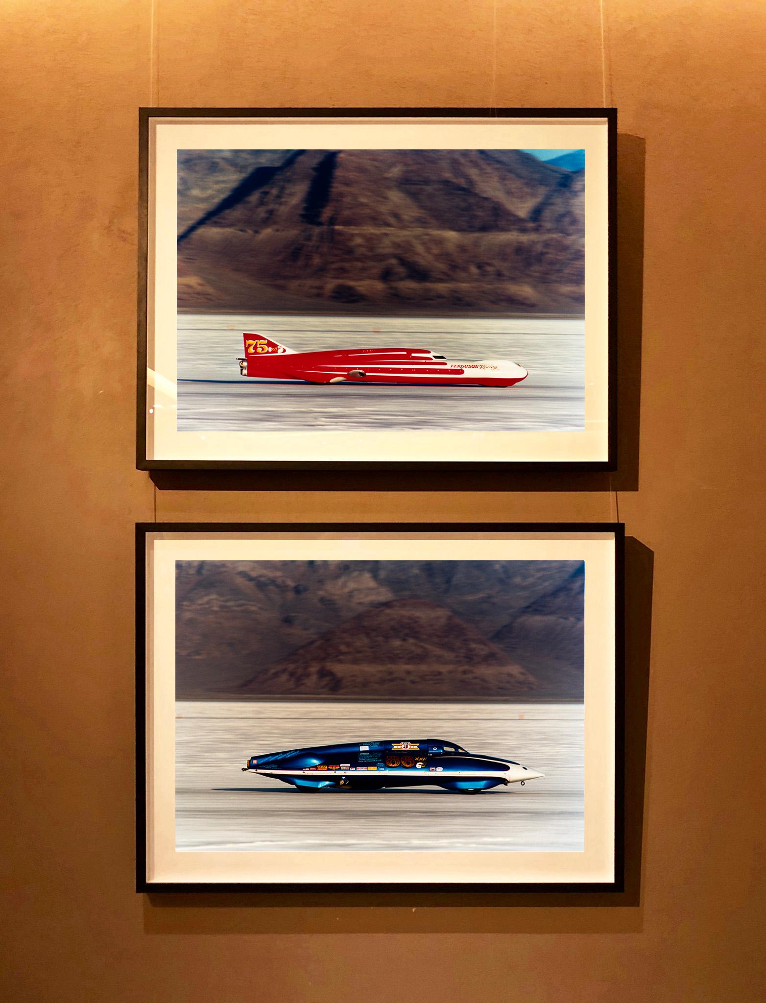 Ferguson Racing Streamliner, photograph taken in the iconic home of speed, Bonneville Salt Flats, just as the mountains contrast with the flatness, Richard Heeps captured this racing car at high speed contrasting with the still effect of the